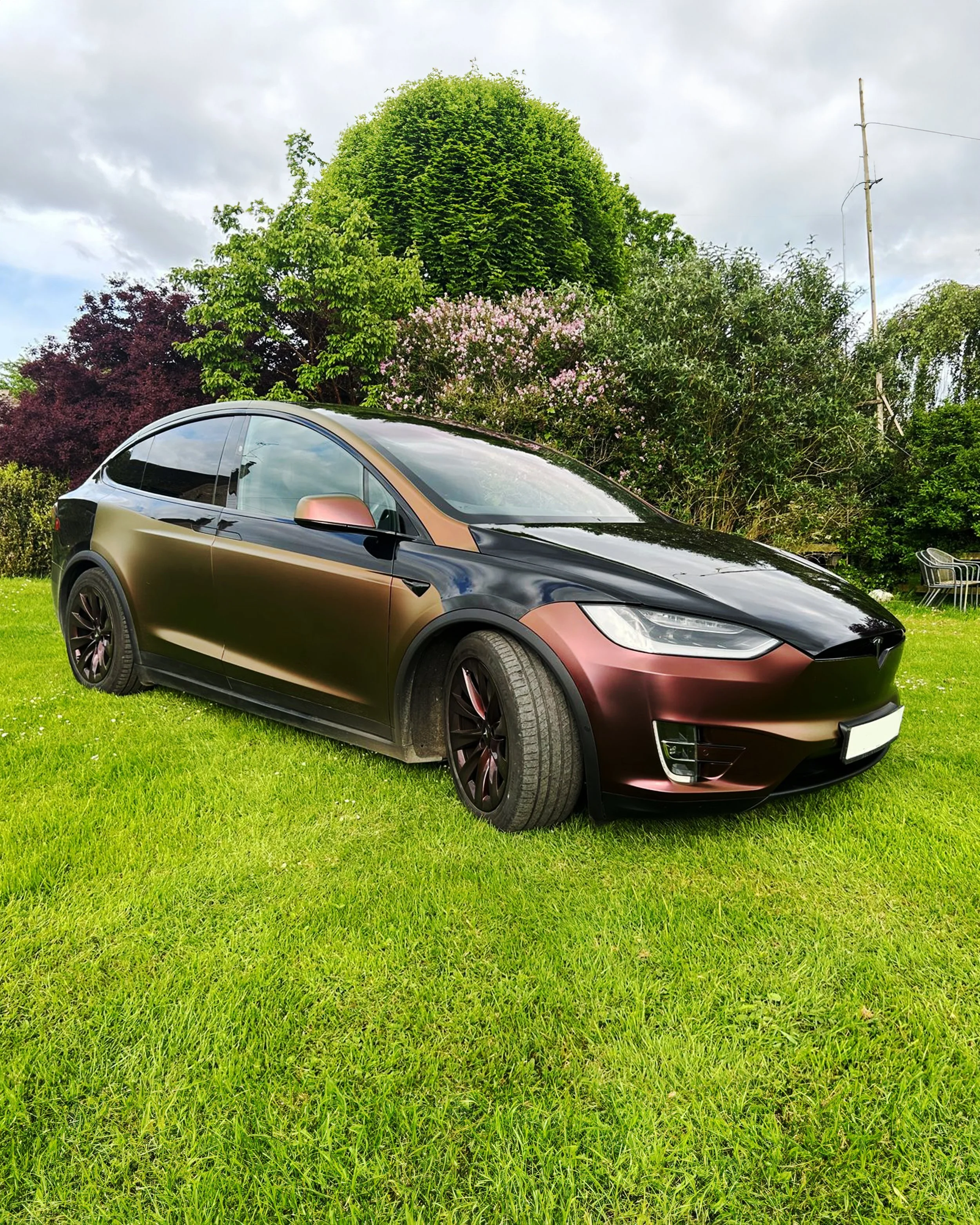 Tesla Model X partial livery custom designed vinyl wrap in 3M Satin Flip Volcanic Flare. Wrapped by Monsterwraps Gloucestershire