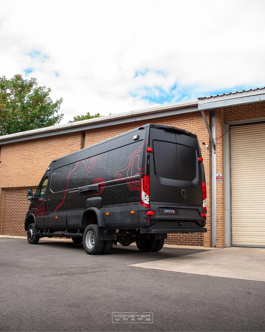 Iveco Daily 4x4 full external colour change vinyl wrap Oracal Matte Black with topographic graphics