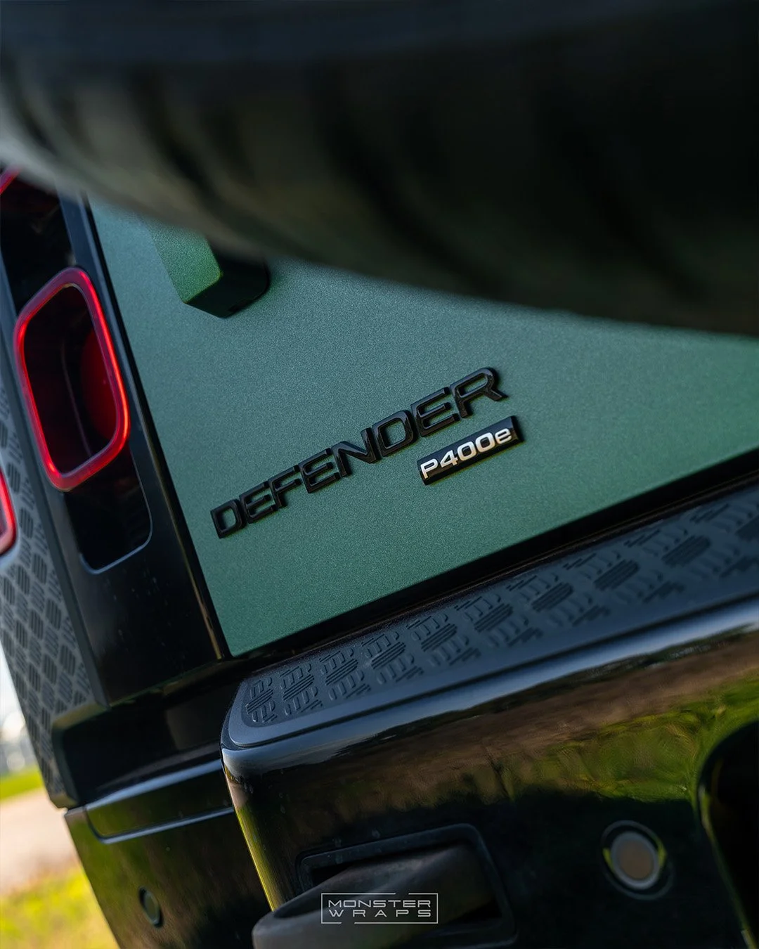 Land Rover Defender 110 lower-half full colour change vinyl wrap in 3M 2080 Matte Pine Green Metallic