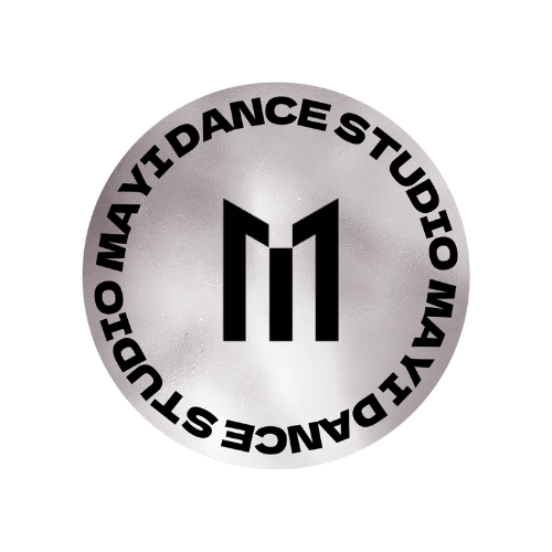 Logo for Mavi Dance Studio, featuring a stylized "M" in the center of a circular, metallic background, with the words "Mavi Dance Studio" encircling the logo.