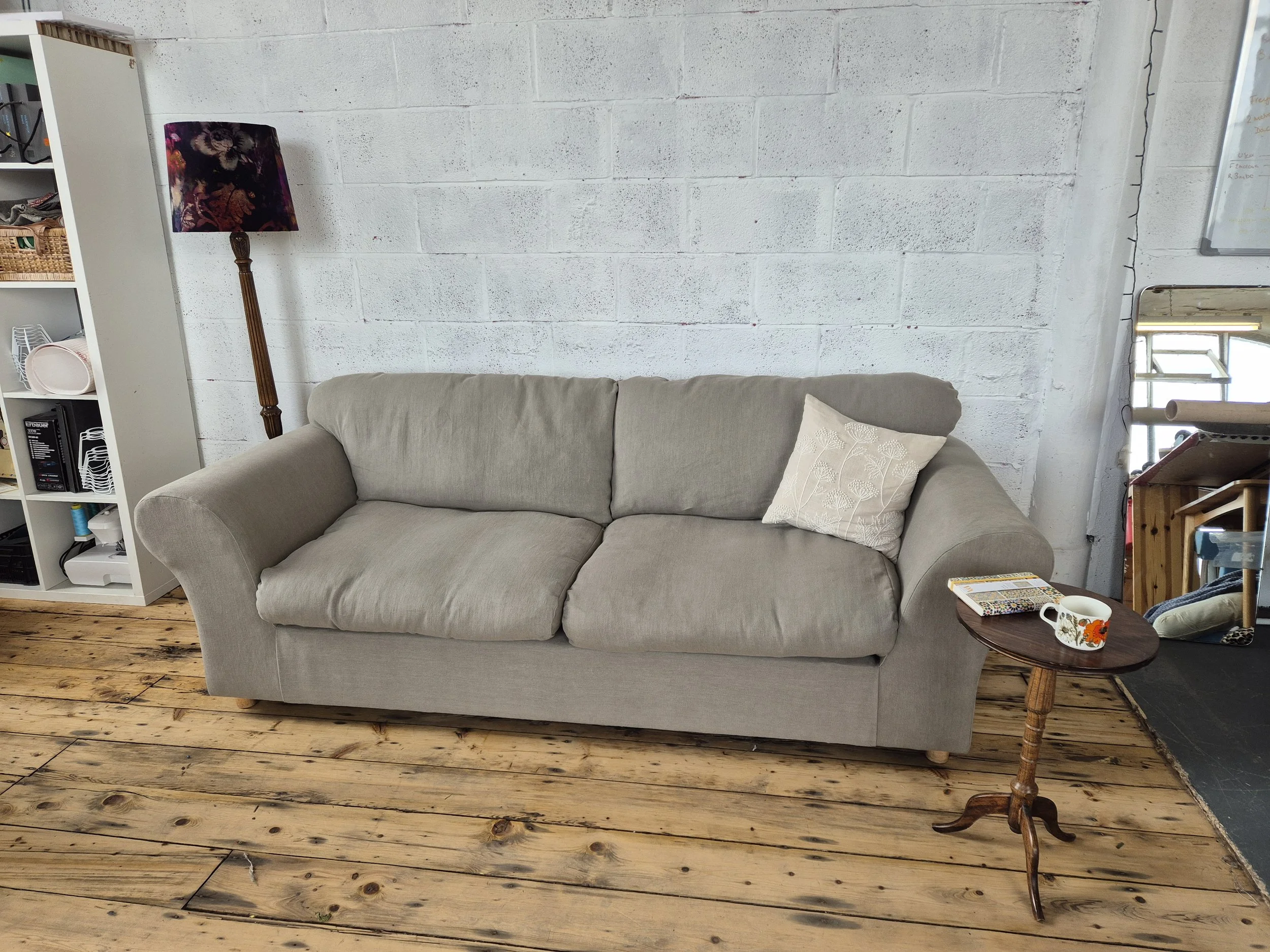 grey reupholstered sofa
