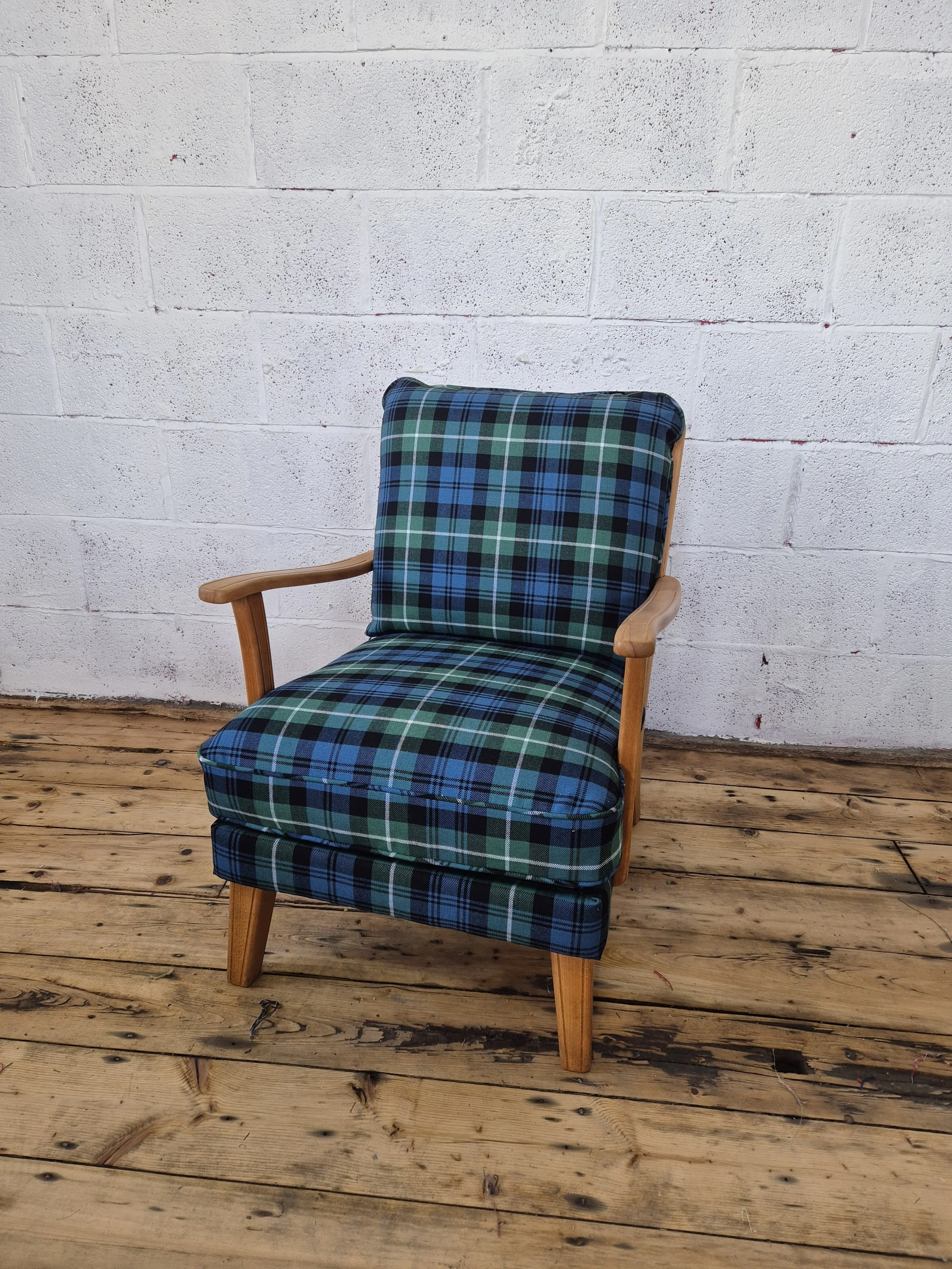 vintage swiss armchair reupholstered in tartan fabric.
