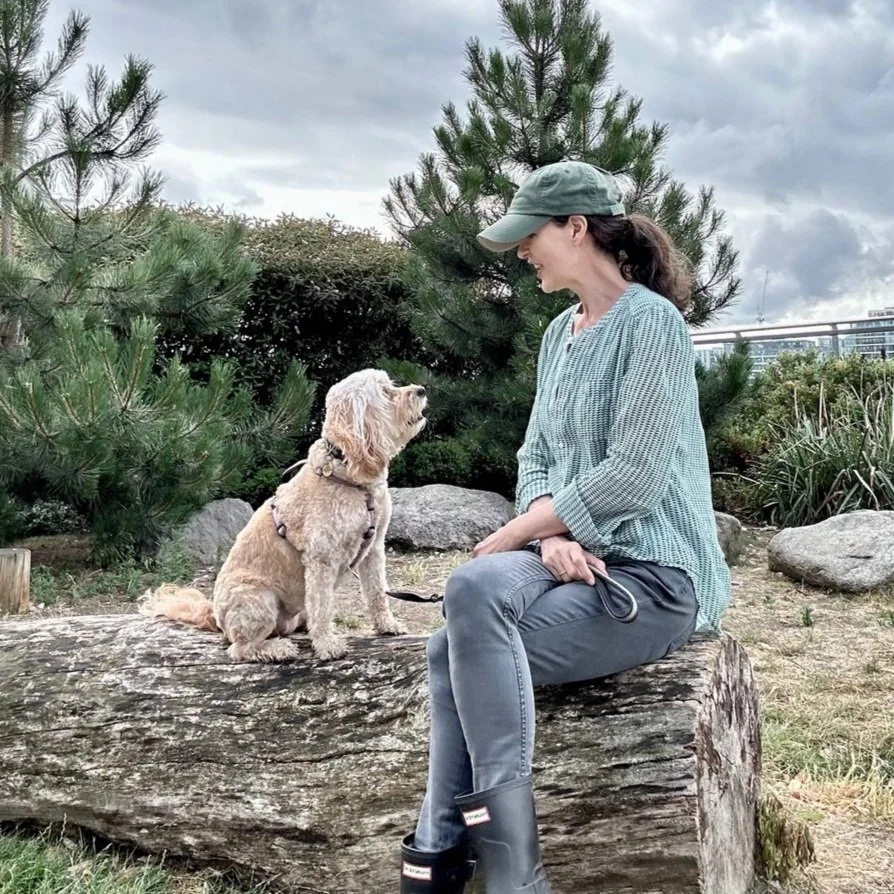 Dog Trainer, Stephanie Ismail from Puppy Life, London sitting with her dog