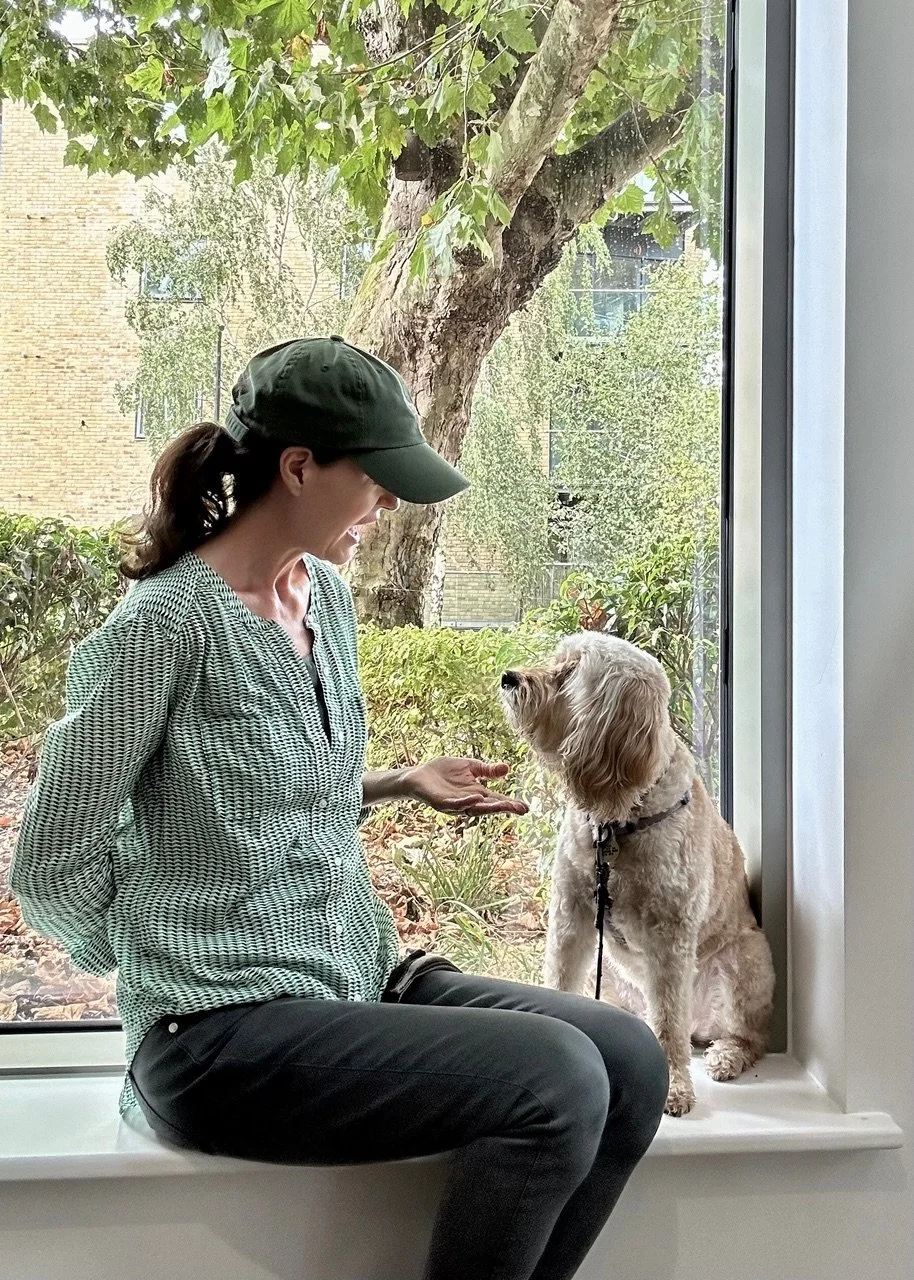 Stephanie Ismail, dog trainer at Puppy Life talking to her dog while training