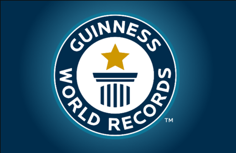Guinness World Records logo with a star and a pillar in the center.