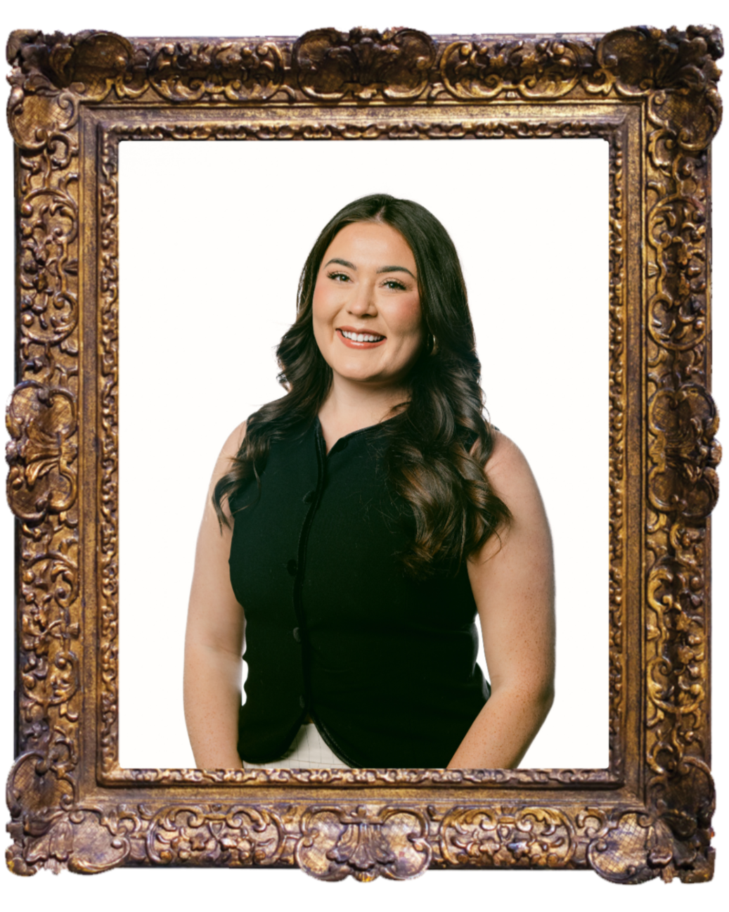 Framed portrait of Alana Anderson with long brown hair wearing a black vest standing against a plain background.