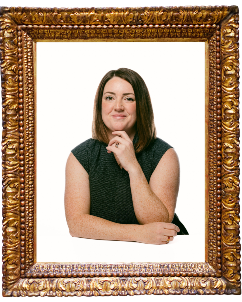 Framed portrait of Jenni Kress with short brown hair wearing a green blouse and sitting down against a plain backdrop.