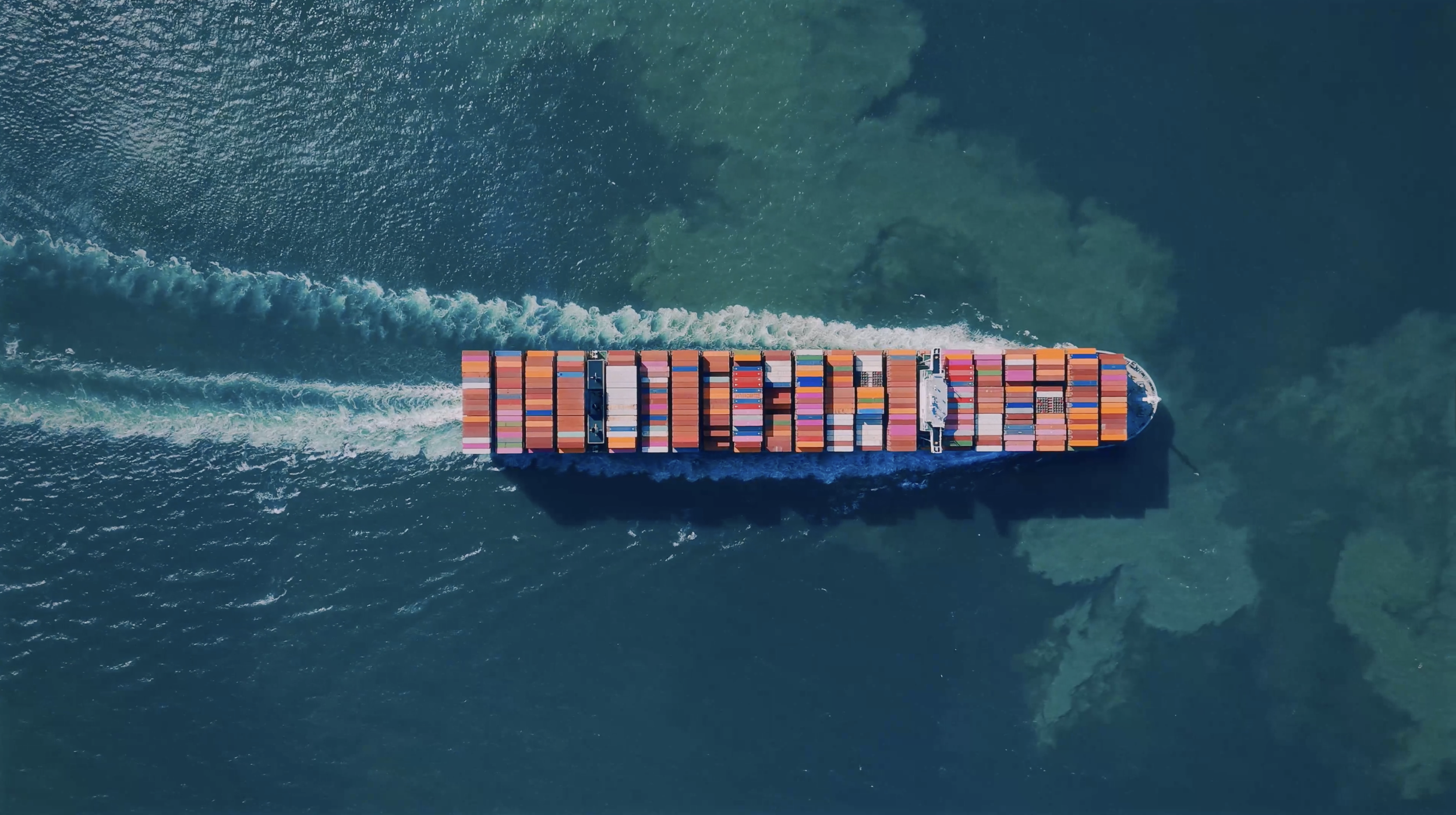 Cargo ship at sea seen from above, representing global energy systems for NESO story strategy project