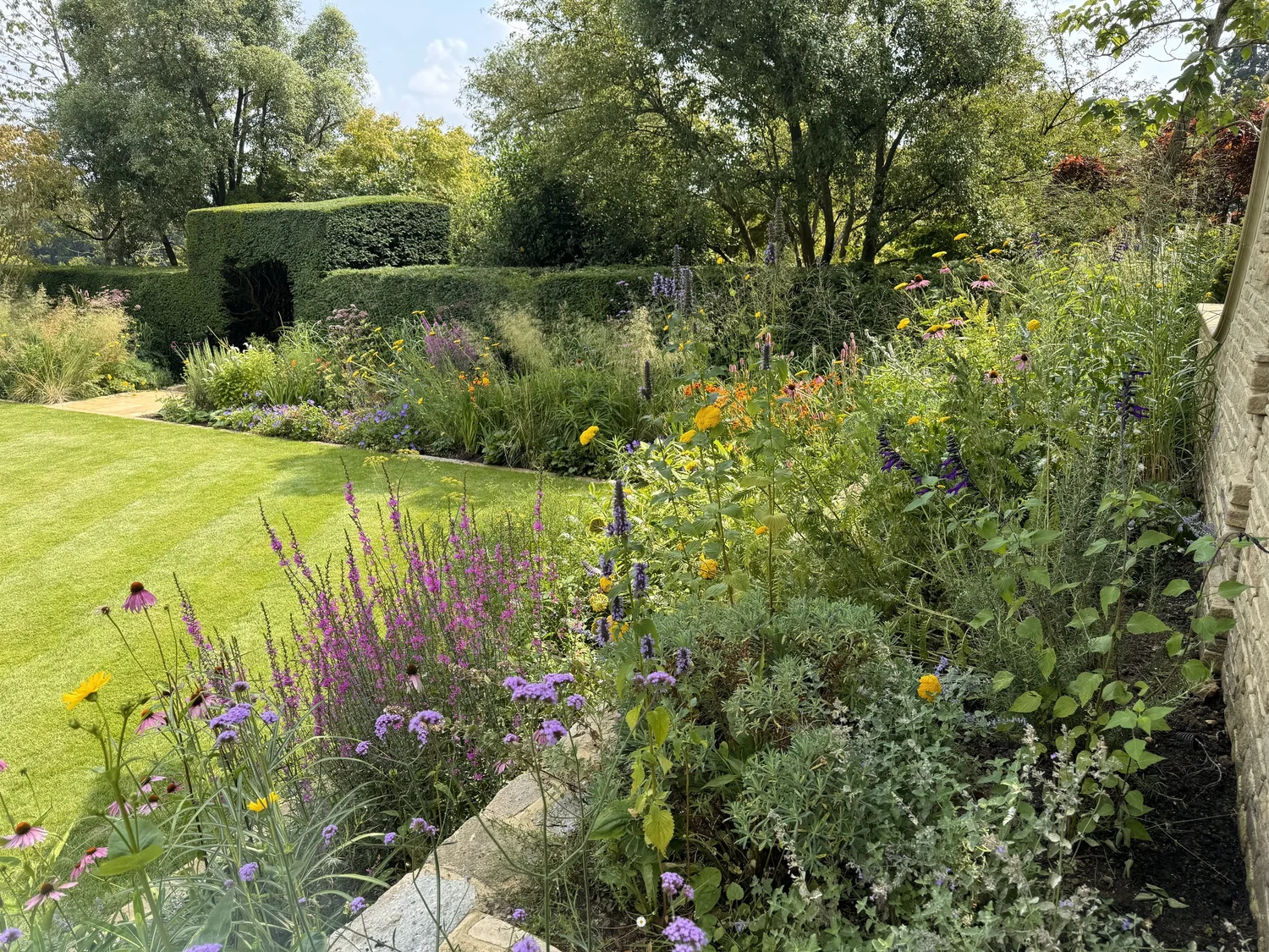 A late summer border of perennials in a private garden