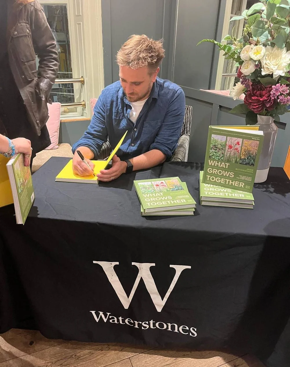 Jamie Butterworth signing copies of What Grows Together