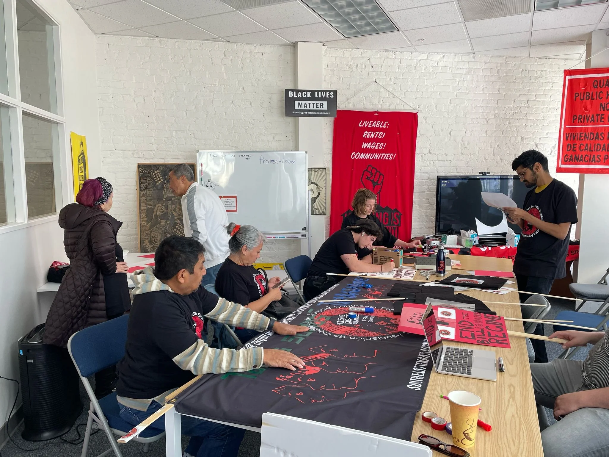 !SETA members making posters for May Day (1).jpeg
