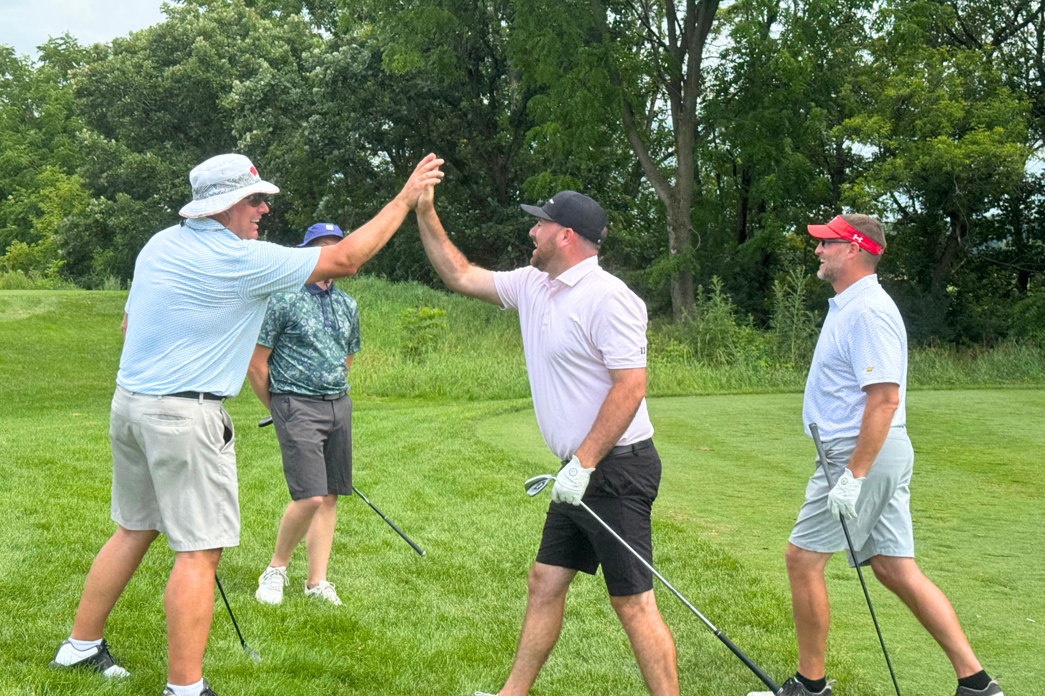 golfers hi five.png