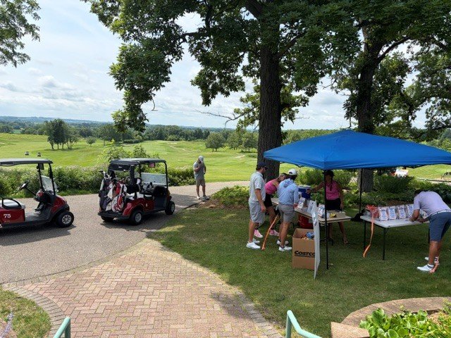 raffle bowl outside area and golfers.jpg