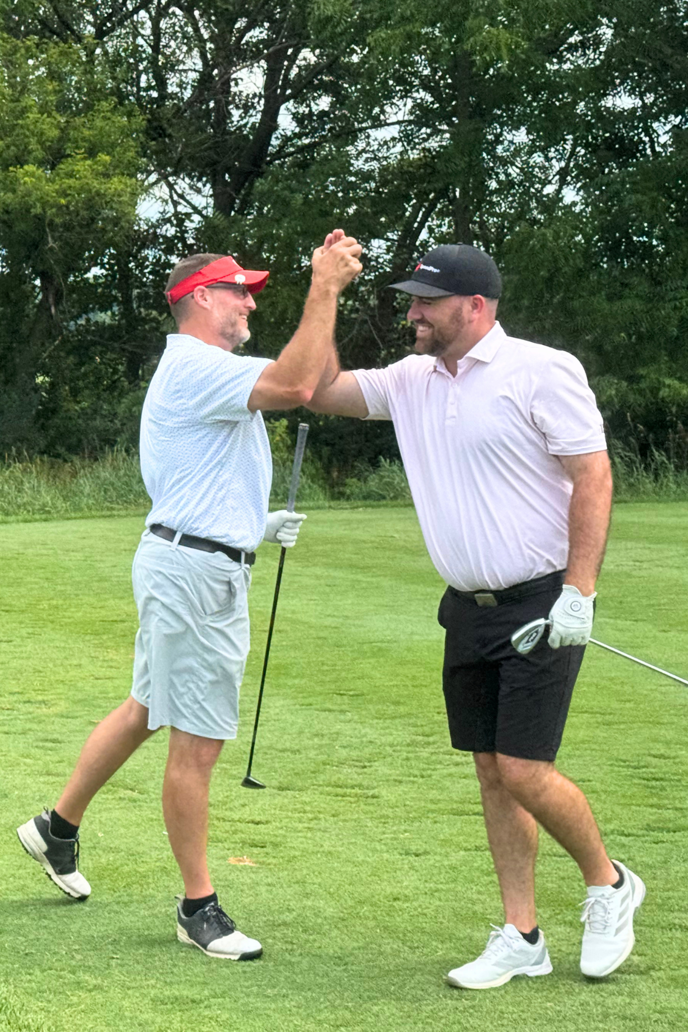 golfers celebrate.png