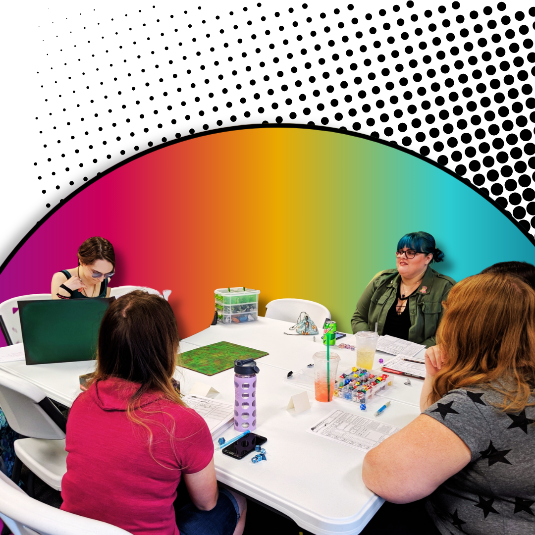 A group of five women sitting around a white table engaged in a tabletop role-playing game or a meeting, with colorful drink cups, game pieces, papers, and tech devices on the table, against a vibrant, rainbow-colored and black-and-white halftone patterned wall.