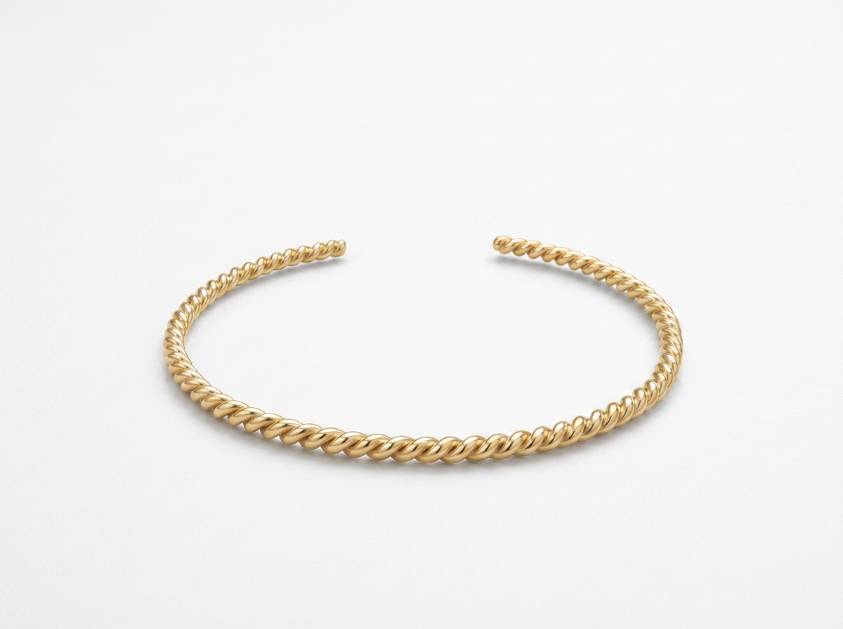 THE GOLD TWIST BANGLE