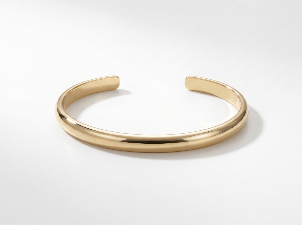 THE THICK GOLD HALF ROUND BANGLE
