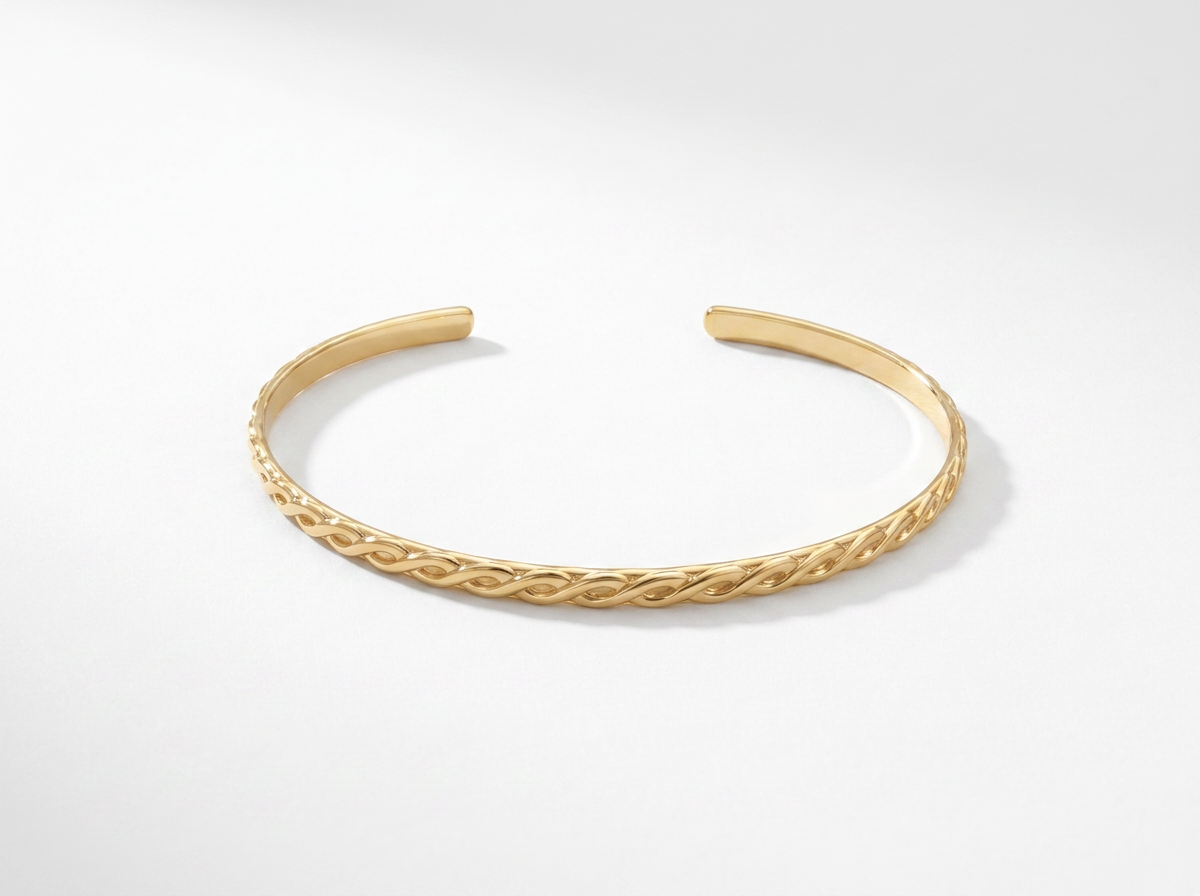 THE BRAIDED GOLD BANGLE