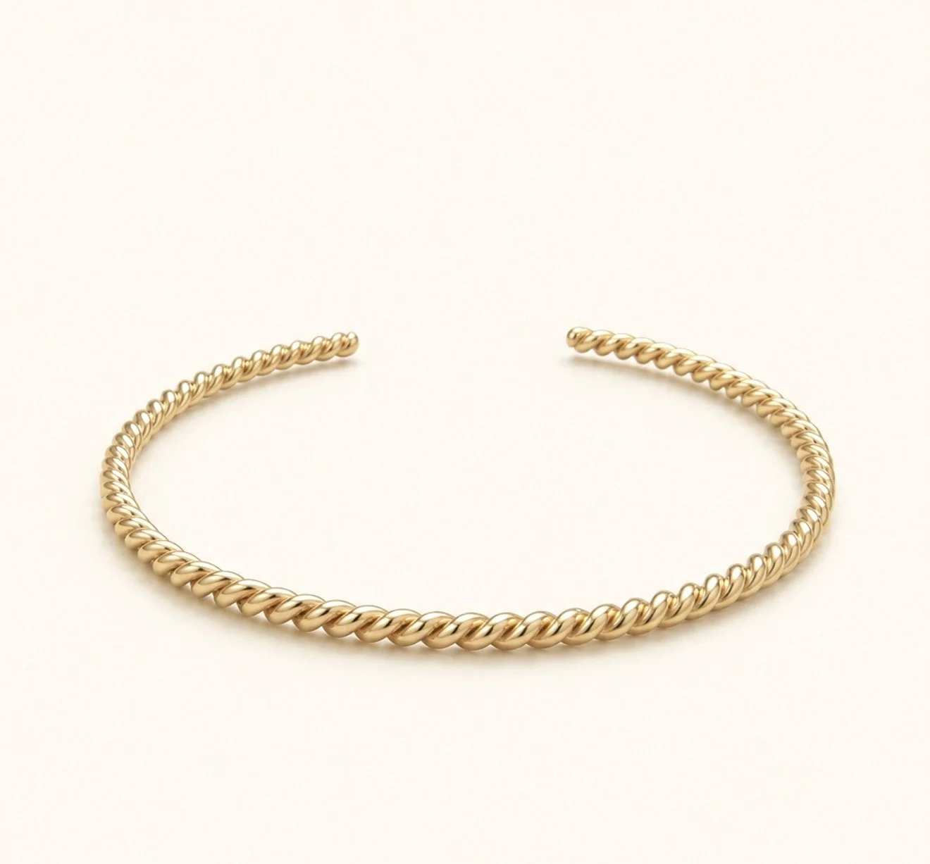 THE GOLD TWIST BANGLE