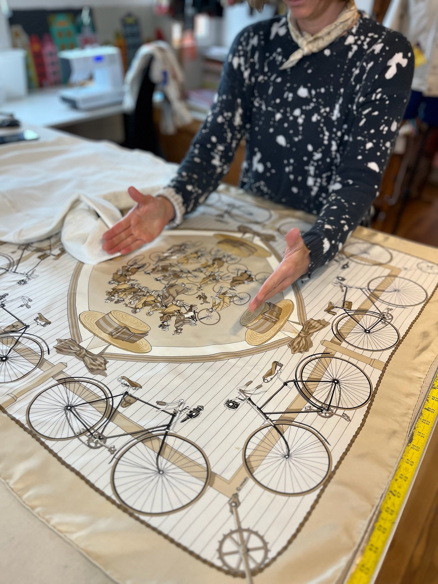 Seamstress mapping bike fabric for jacket lining