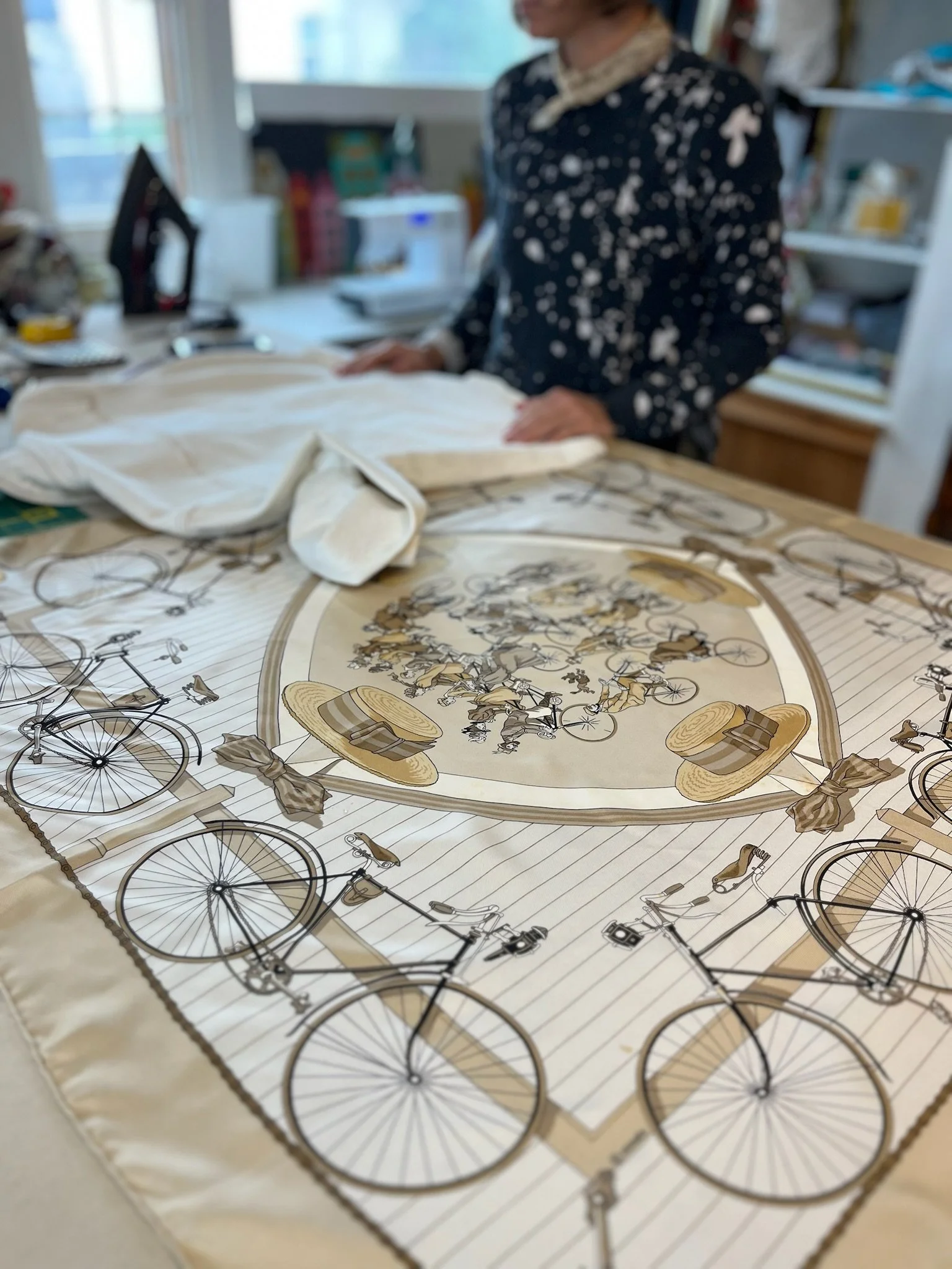 Seamstress mapping bike fabric for jacket lining