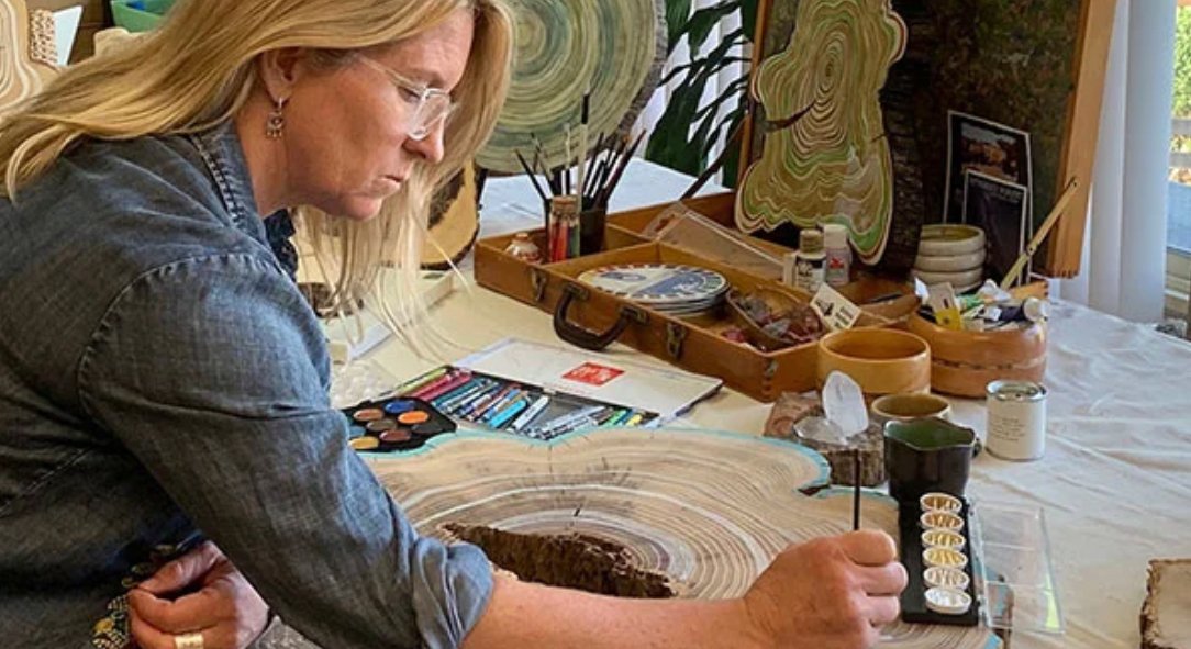 Nicole in her studio painting