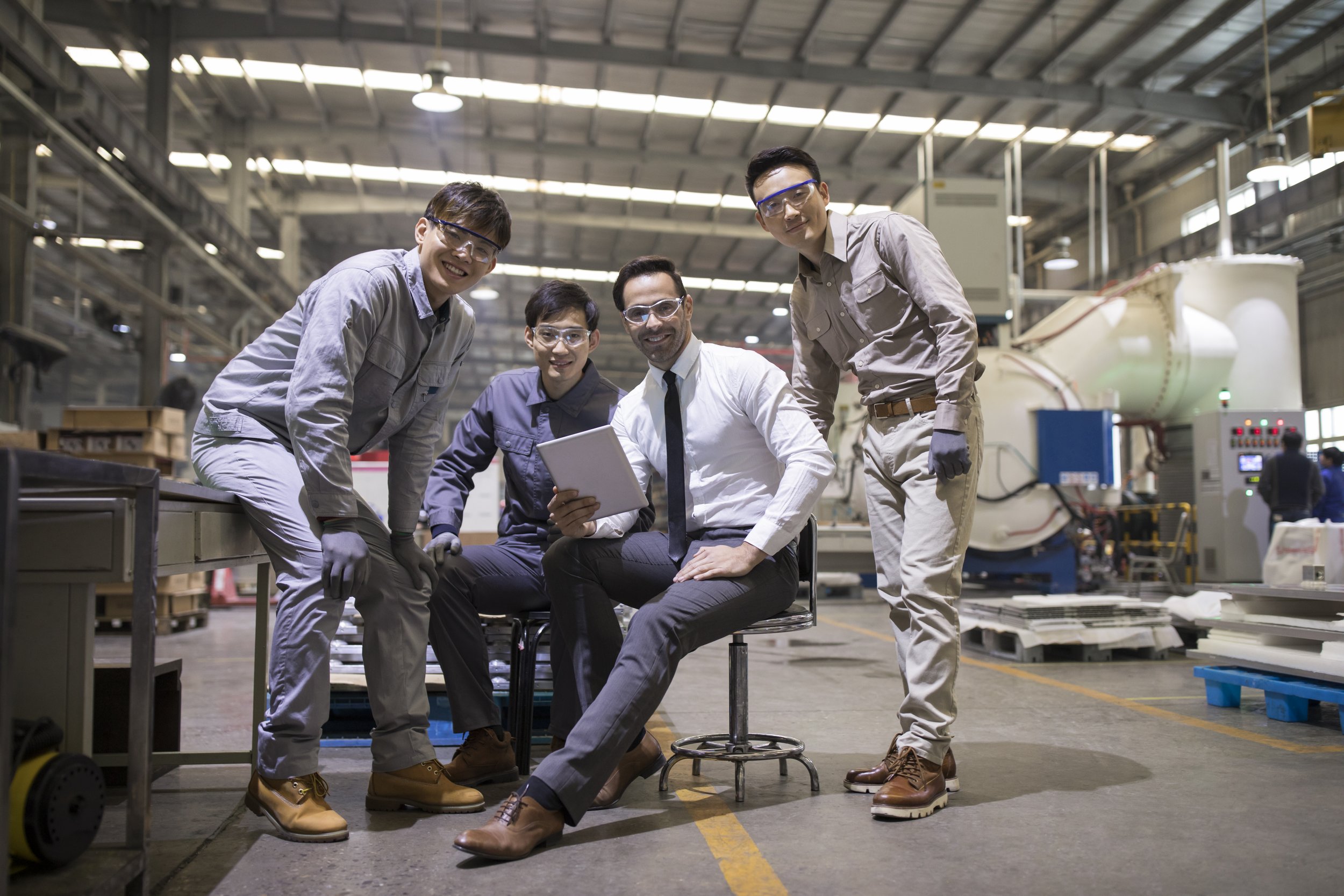 businessman-and-engineers-talking-in-the-factory-2023-11-27-05-34-51-utc.jpg