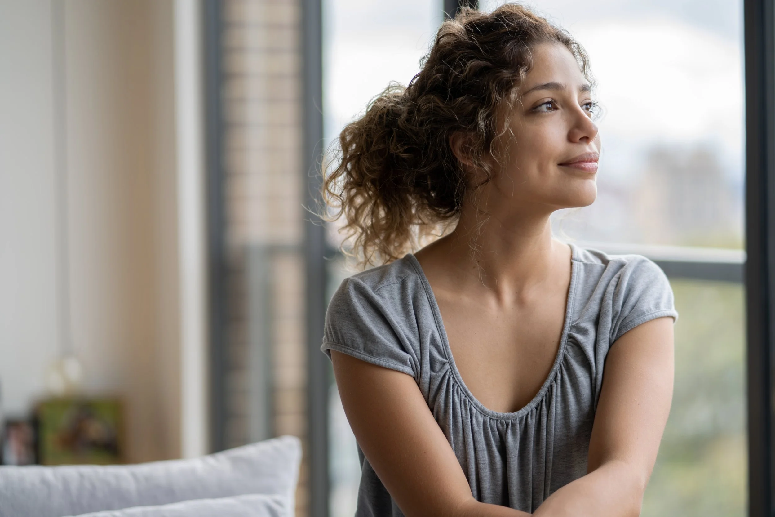 A woman looking out representing hope and healing from stress anxiety depression with individual counseling at Becoming Therapy Center in Clarksville, TN