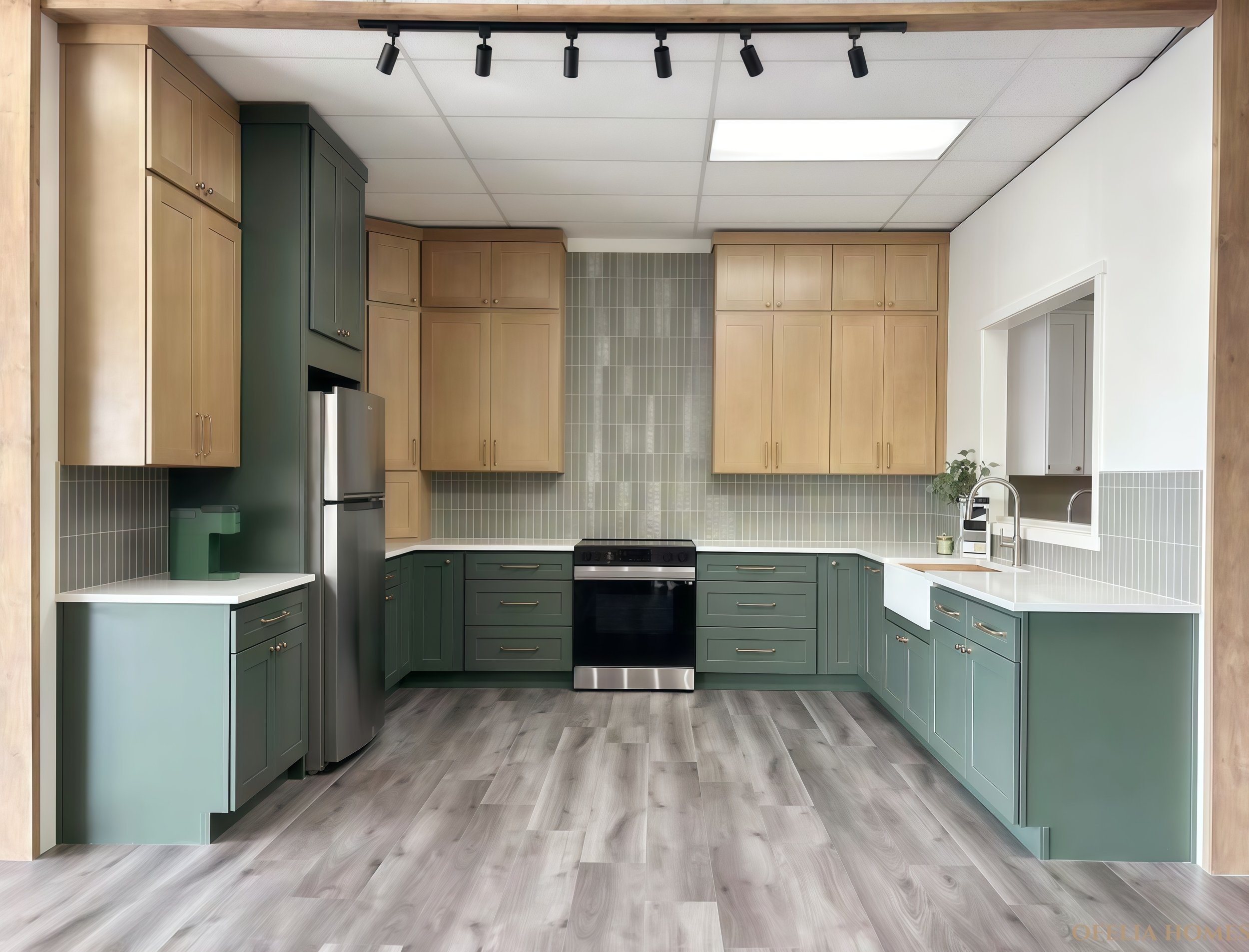 Modern kitchen with green lower cabinets and wooden upper cabinets, stainless steel appliances, light wood flooring, and track lighting.