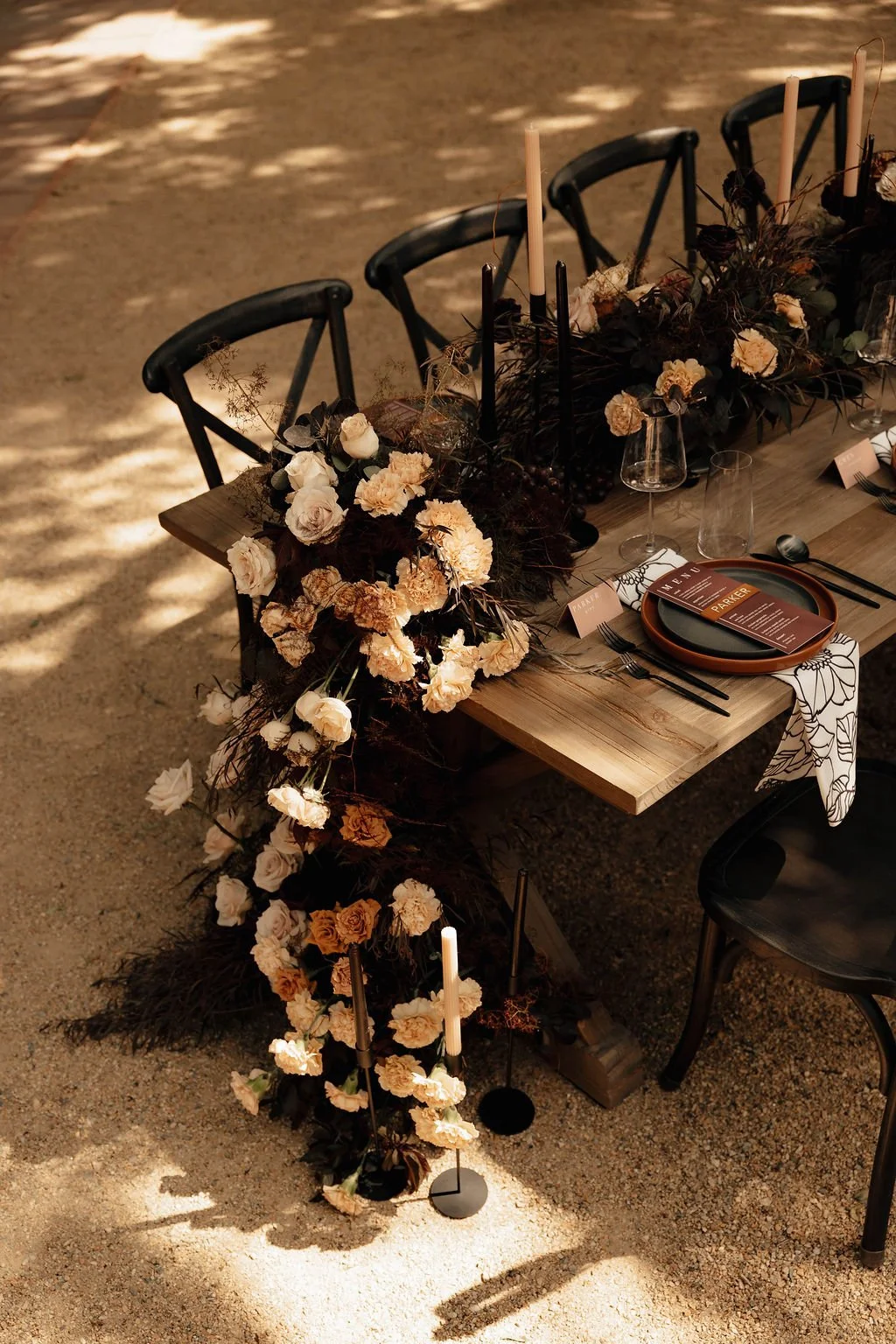 luxury wedding tablescape with moody colors and luxury tableware by colorado wedding planner