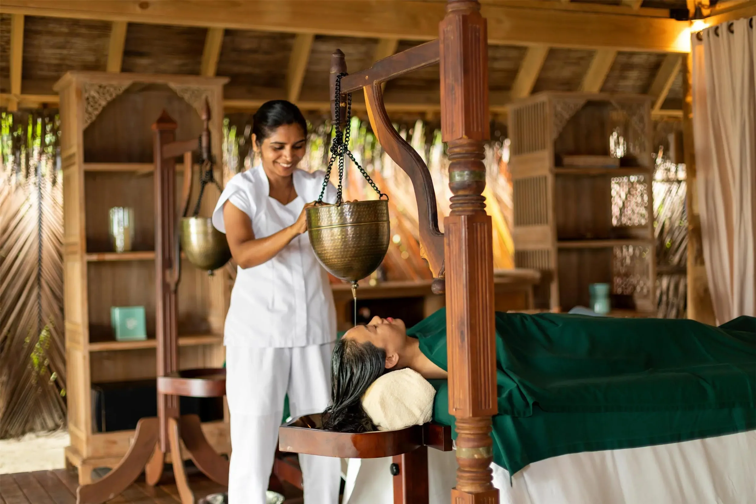 Luxury wellness retreat with Ayurvedic spa treatment curated by The Three’s Club for relaxation and holistic well-being.
