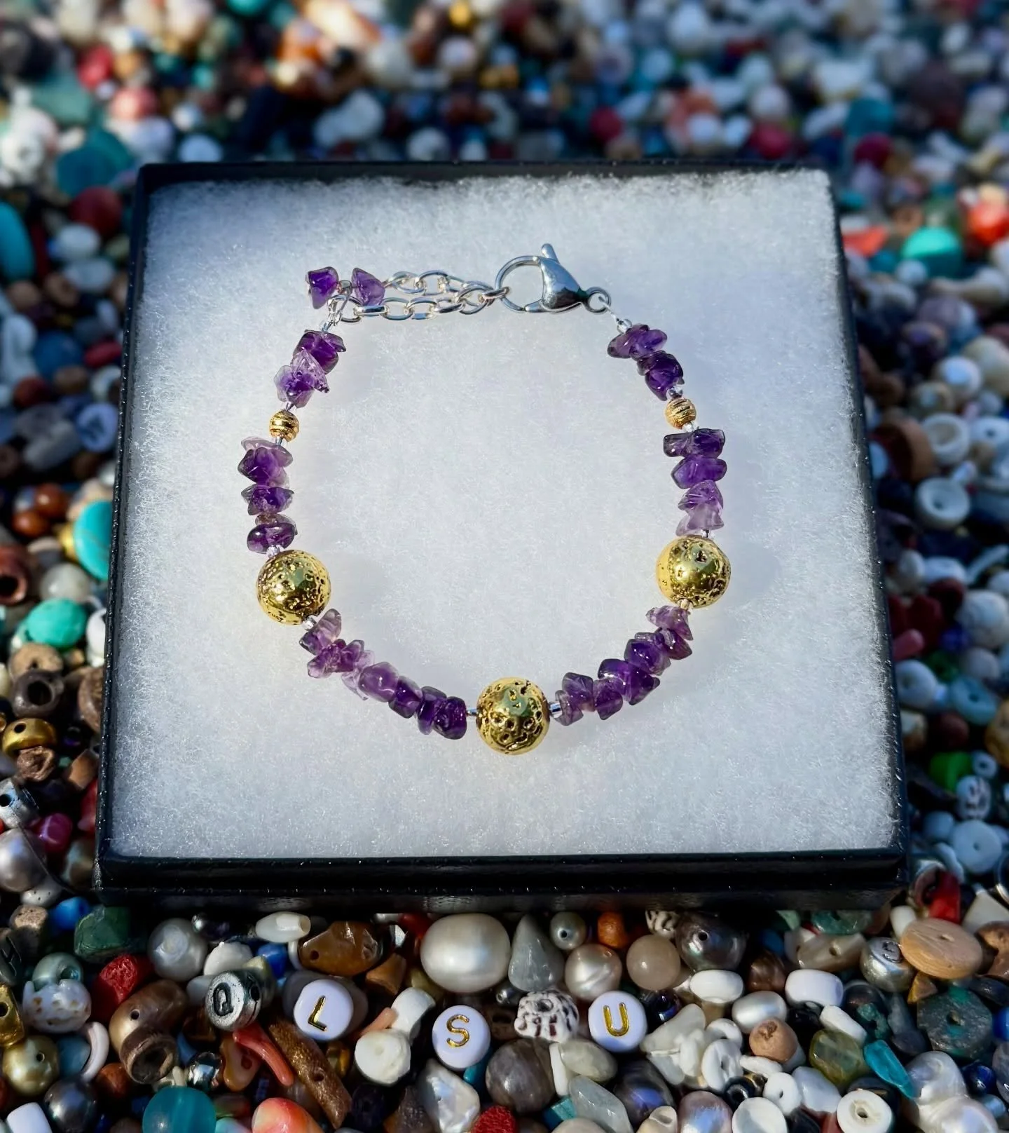 ✨ New handmade Amethyst &amp; Metalized Lava Rock Bracelet
Rich purple amethyst paired with golden metalized lava rock! 

Perfect for LSU Tiger Pride &mdash; subtle, stylish, and full of good energy 🐯💜

Come see us this weekend or message me for mo