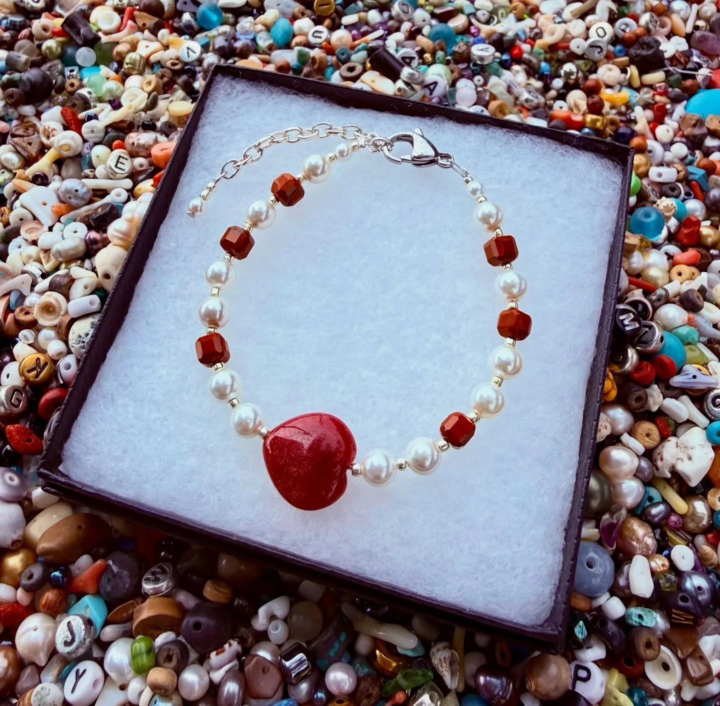 Celebrating love on this beautiful valentines day! 🫶 look at this stunning one we just made 😍 Red Coral + Pearl and a Jade heart ❤️

We are at @mandevilletrailheadmarket till 1pm and tomorrow we will be @abitasprings.farmersmarket