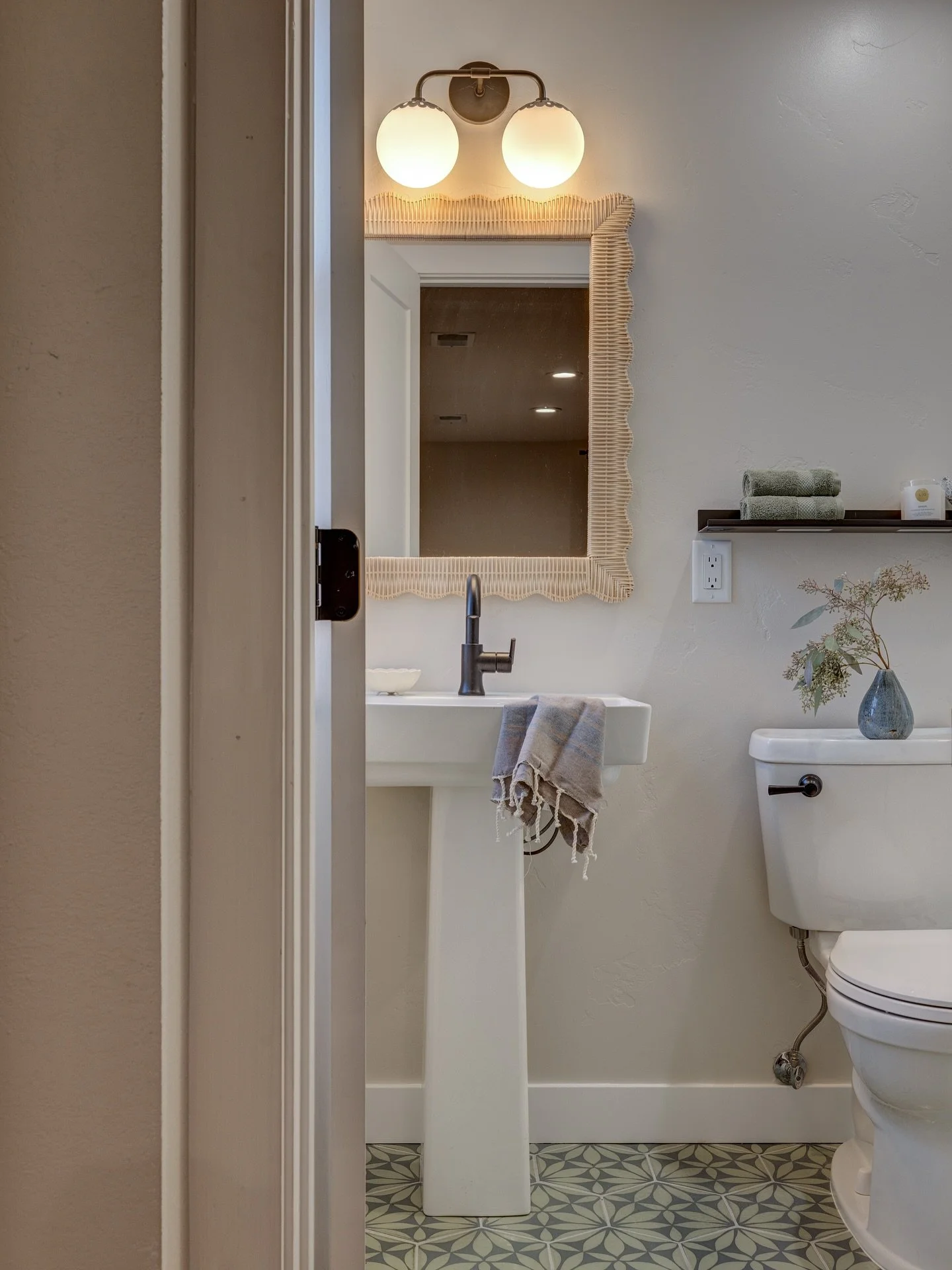 Clean lines, bold tile, and just the right amount of contrast&mdash;this guest bath strikes a balance between playful and refined. We love how the details came together to create a space that feels fresh and modern.