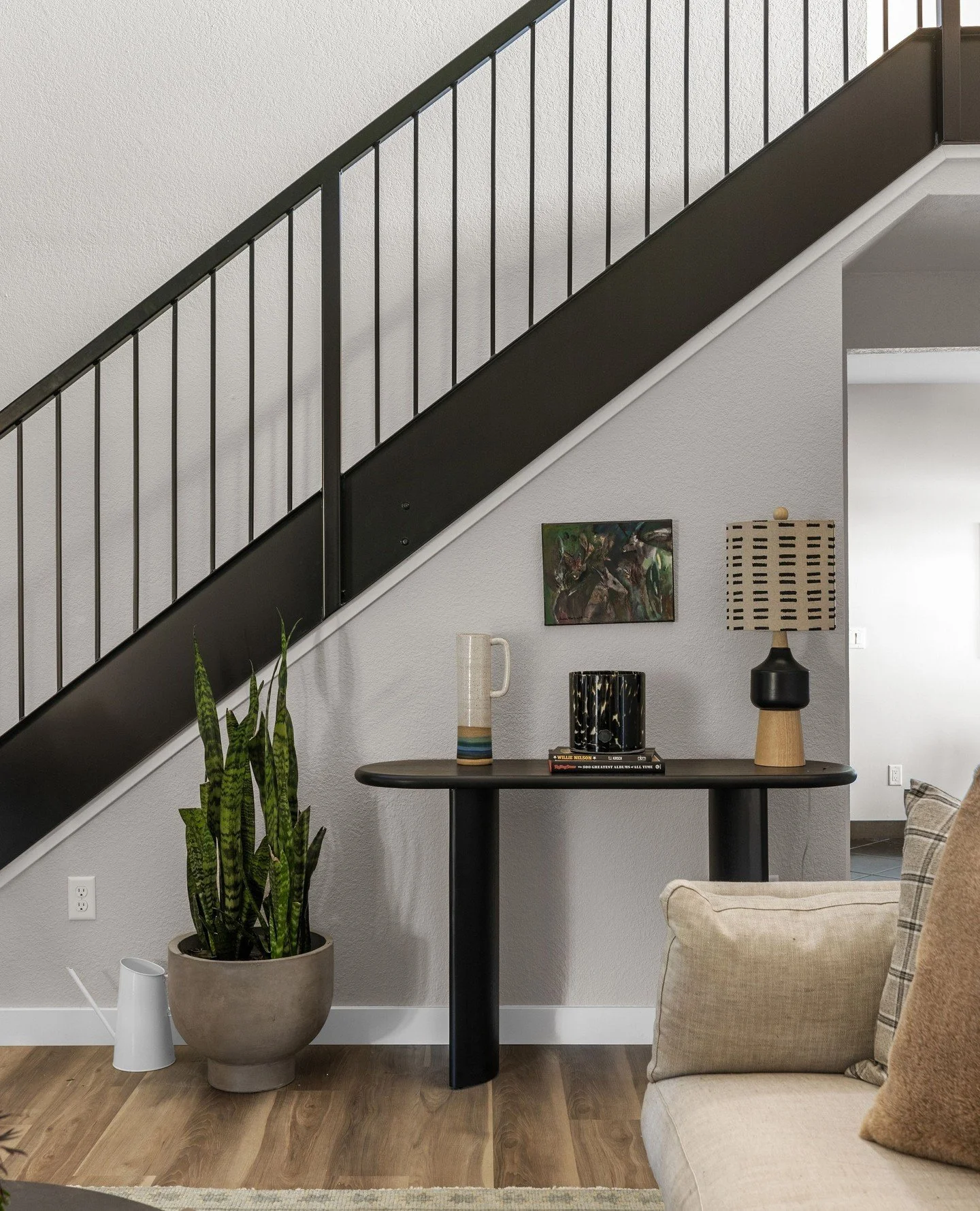 A closer look at the living room &mdash; the before and after is truly dramatic. Every update, from furnishings to fixtures, elevated the space and makes it a place you&rsquo;ll want to spend time in.