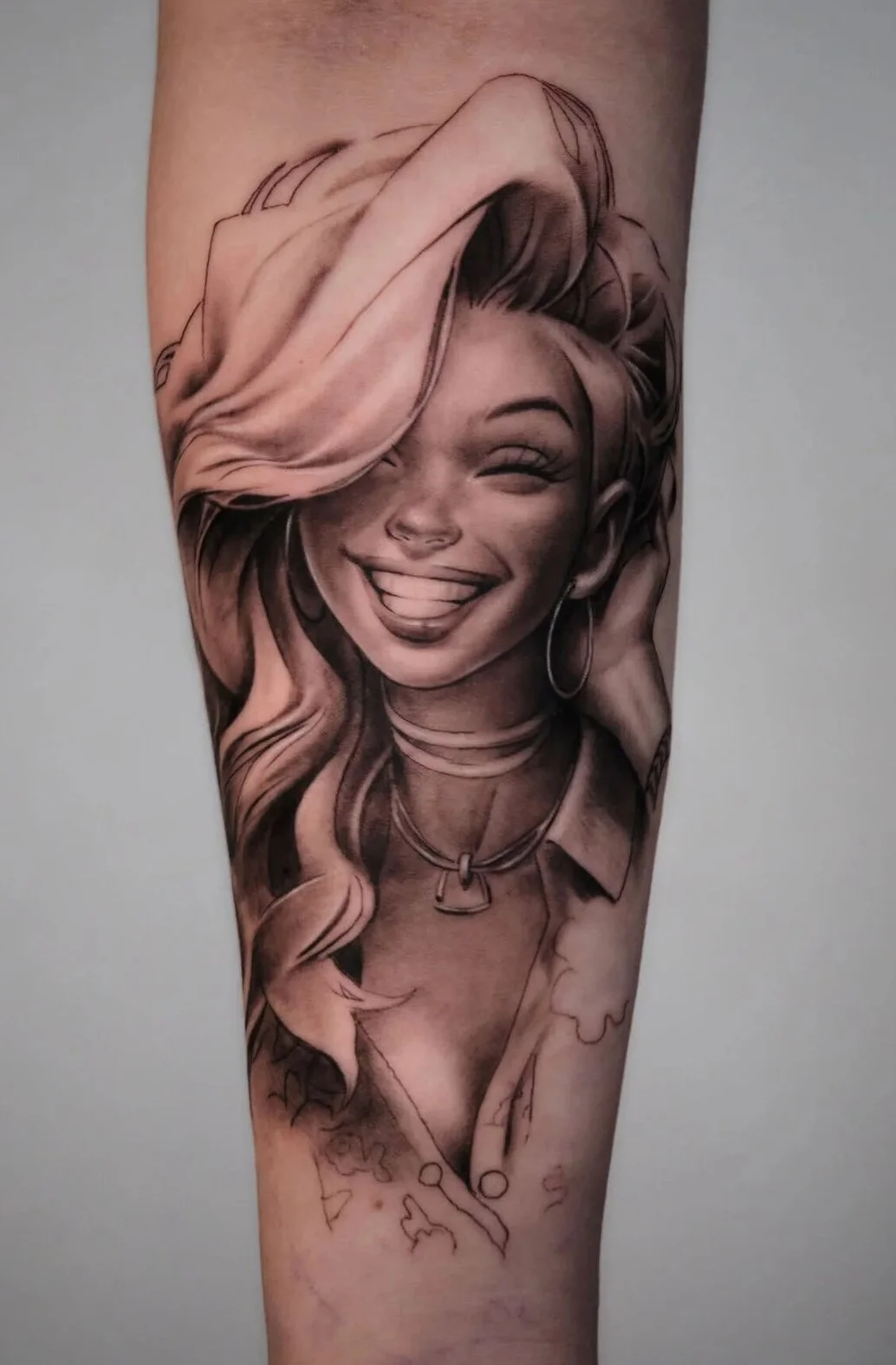 binx-artist-woman-portrait-smiling-wavy-hair-forearm-tattoo.jpg