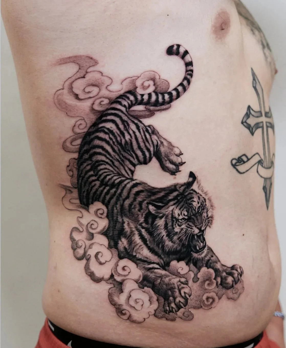 harris-artist-blackwork-tiger-sword-japanese-clouds-torso-tattoo.jpg