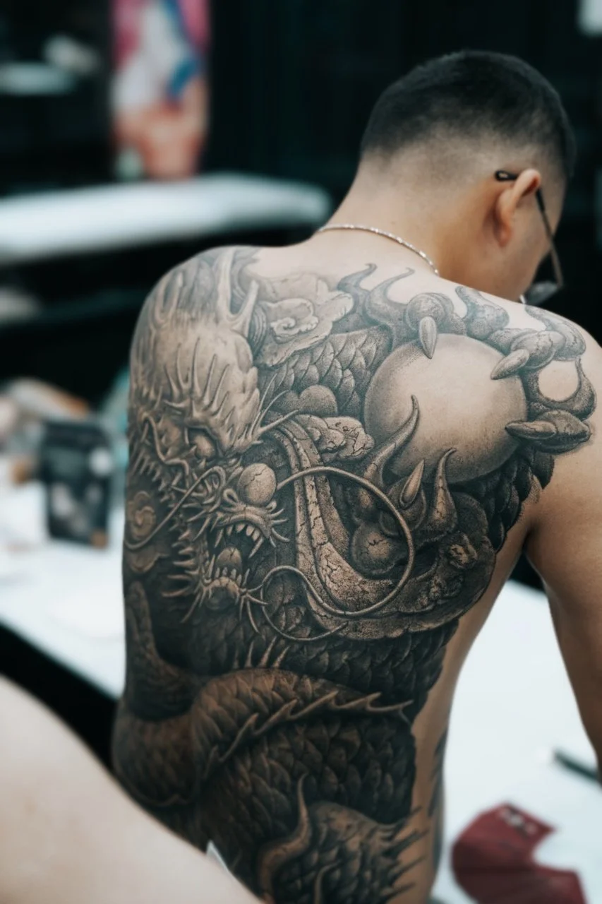 binx-artist-large-dragon-back-piece-black-and-gray-tattoo.jpg