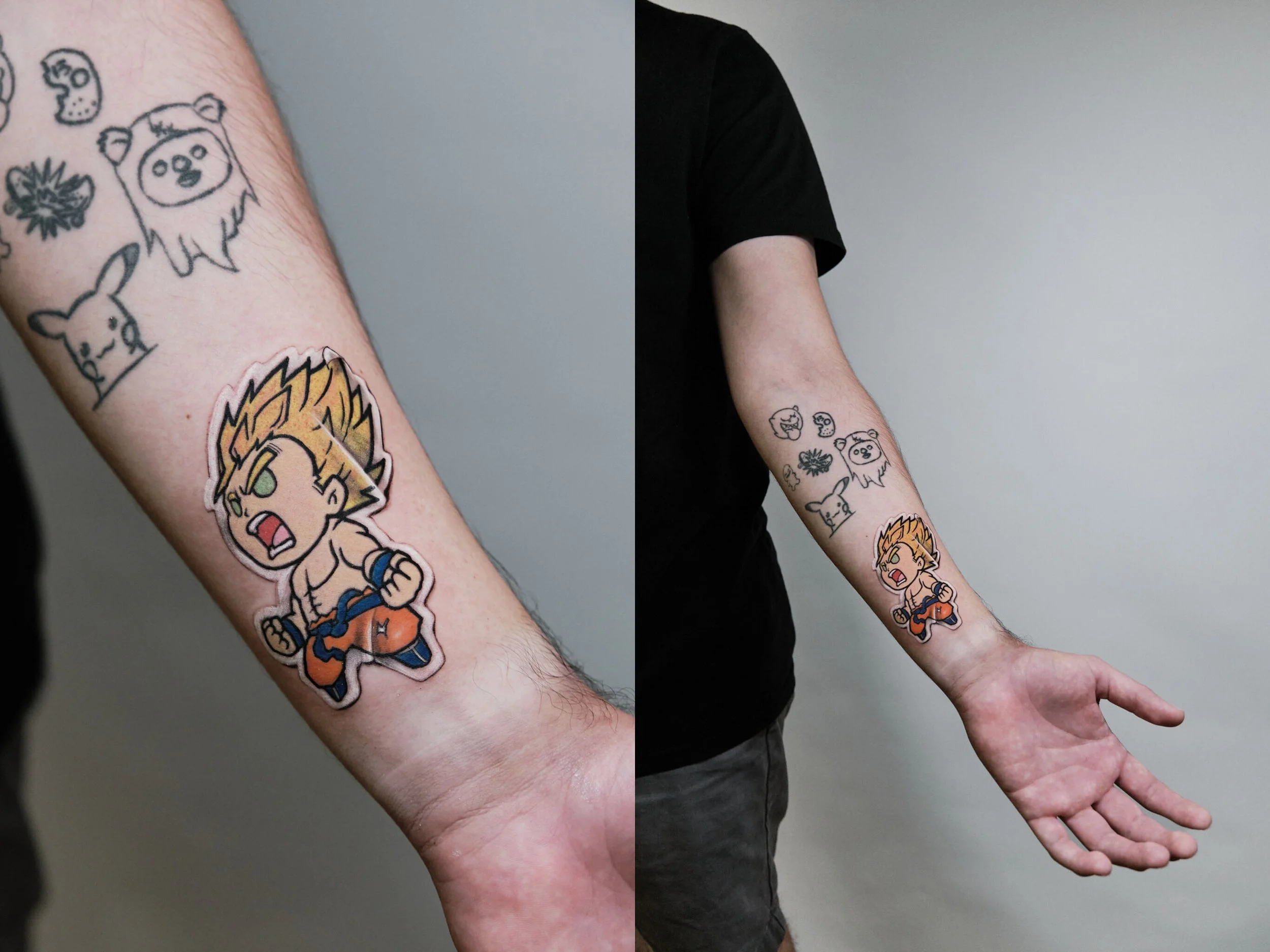 A person with tattoos on their arm, including a cartoon character with spiky hair and clenched fists, and smaller tattoos of cute animals and faces.