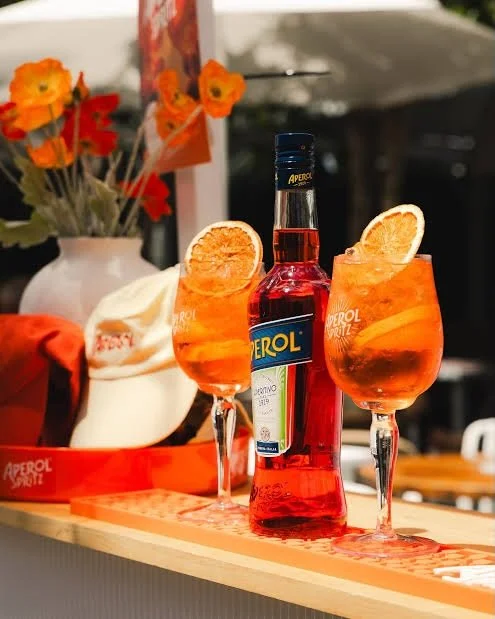 ☀️ Aperol Spritz season is officially ON.

Buy 2 Aperol Spritz &rarr; score a FREE Aperol hat 🧡
We&rsquo;ve got caps AND everyone&rsquo;s favourite bucket hat up for grabs.

$10 each during Happy Hour till 8pm! 

(Limit 1 per customer&hellip;sharing