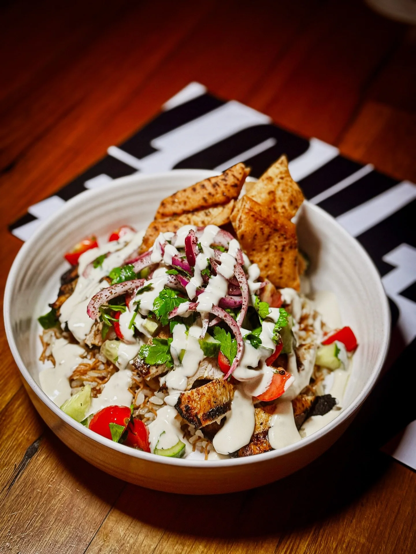 This one&rsquo;s a favourite for a reason.

Flame-grilled spiced chicken, vermicelli rice, fresh cucumber, tomato and parsley salad, lemon tahini, sumac onions and crunchy za&rsquo;atar chips &mdash; it hits every time.

Easy, comforting, full of fla