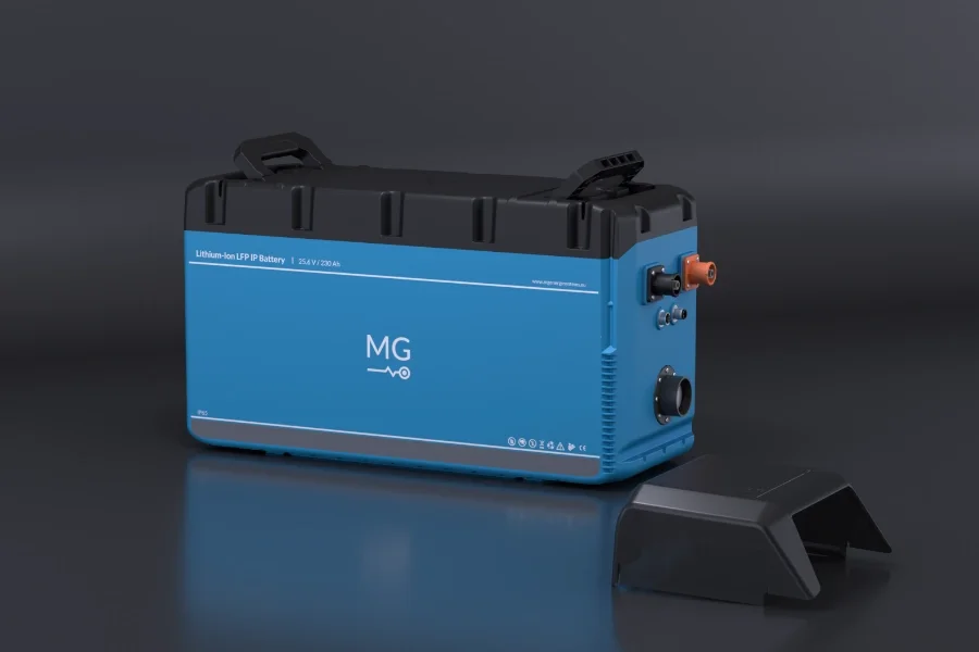 A blue lithium-ion MG 230Ah IP65 battery with black top, placed on a black surface with a black cover in front of it.