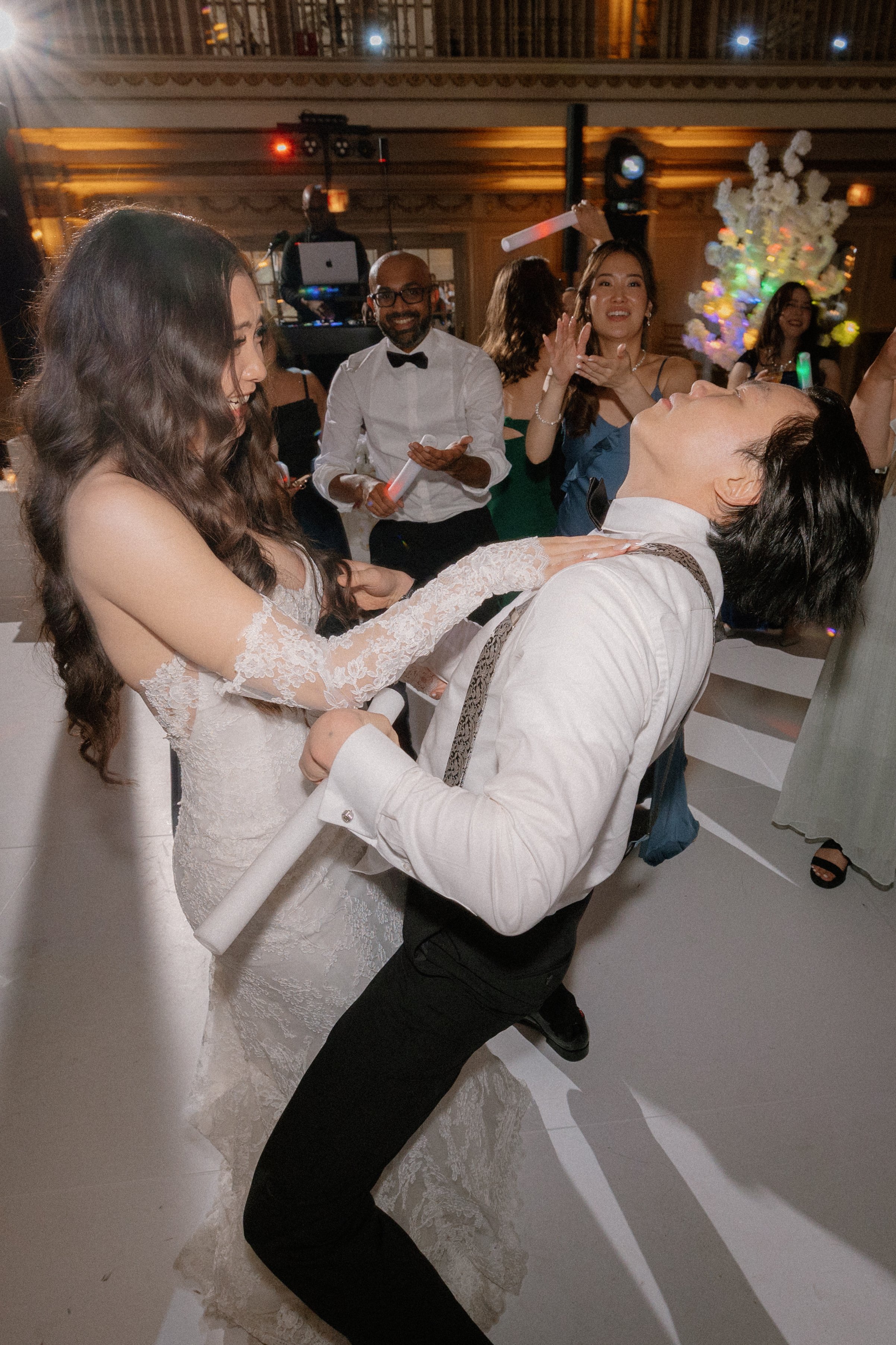 Tiffany and Jon celebrate dancing  on a packed dance floor