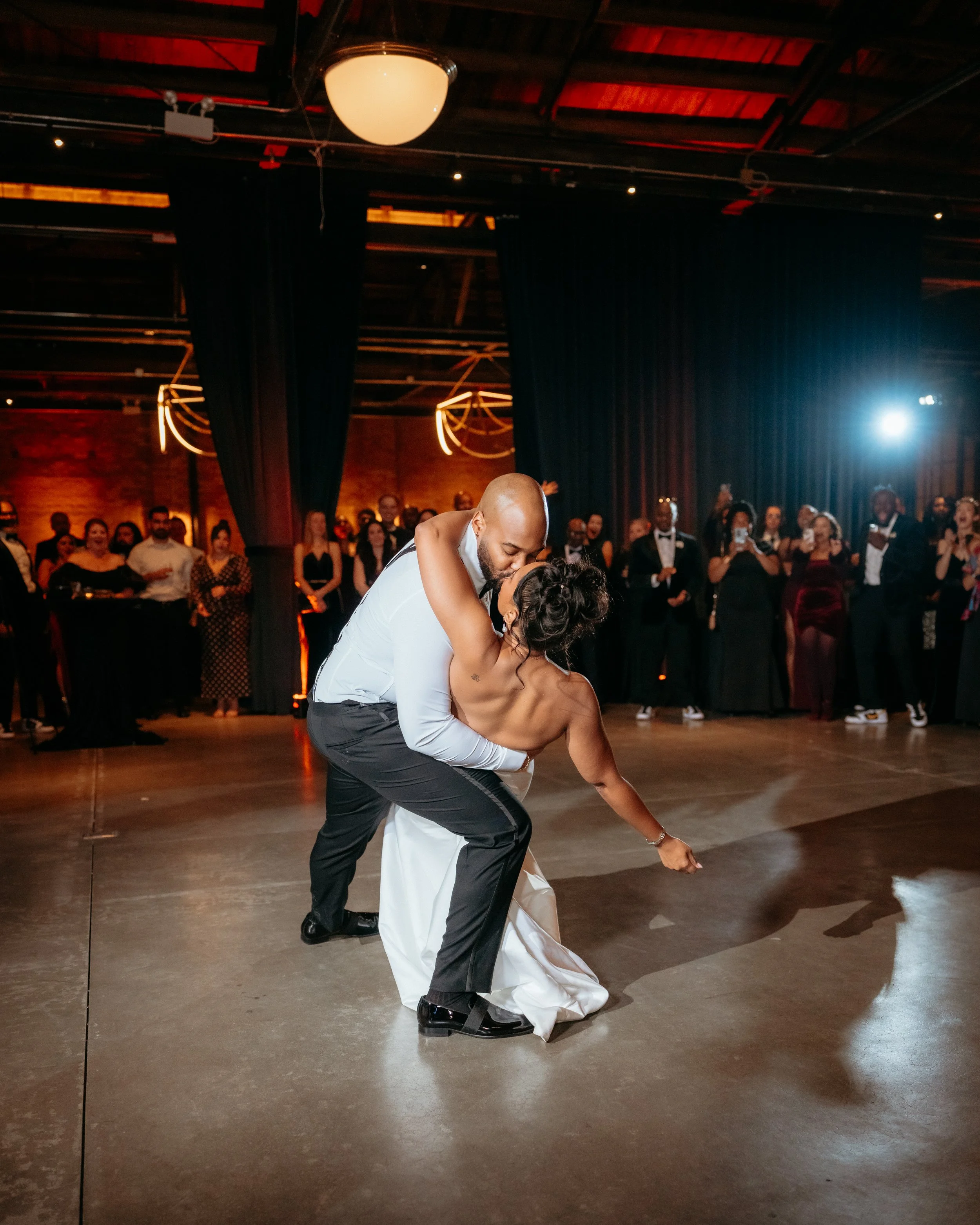 Couple kissing during their wedding first dance
