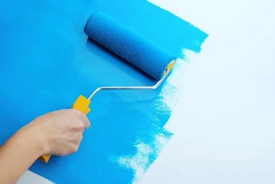 painting-wall-bright-blue-during-renovation.jpg