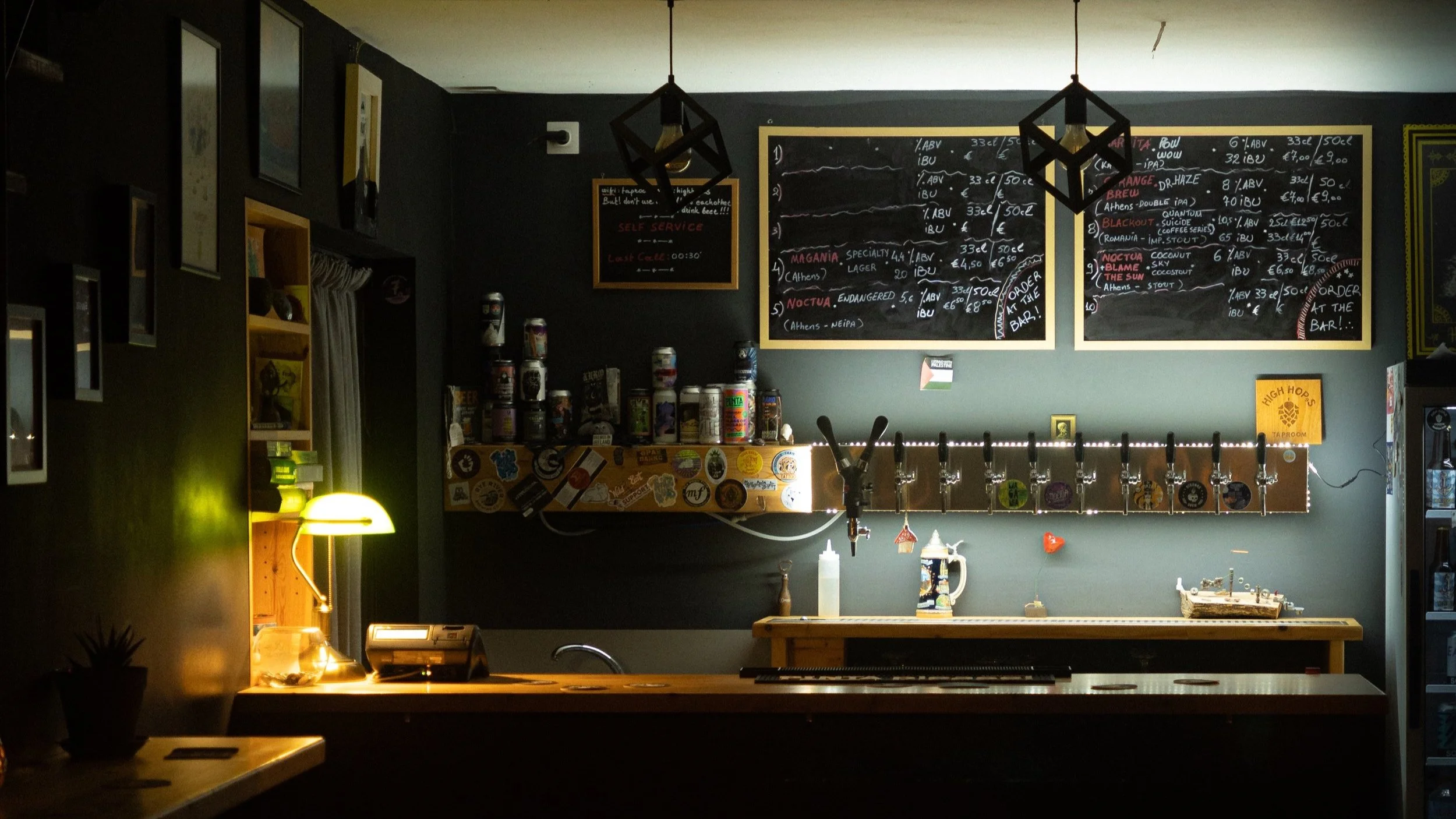 The High Hops bar, beer taps and menu board in warm evening light.
