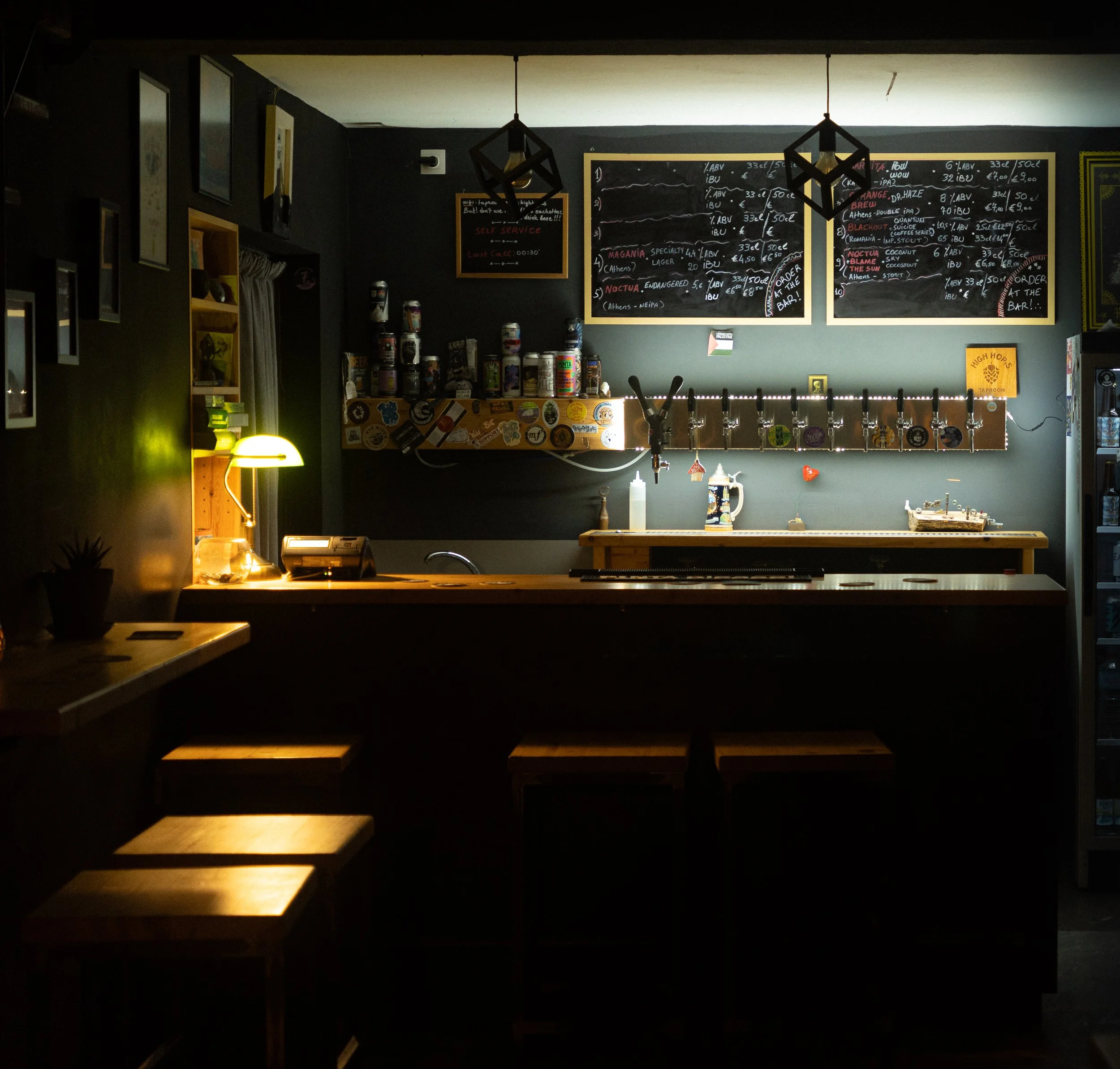 A view across the High Hops taproom towards the bar and illuminated taps.