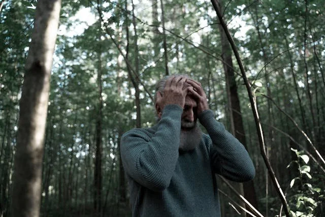 man in woods in panic