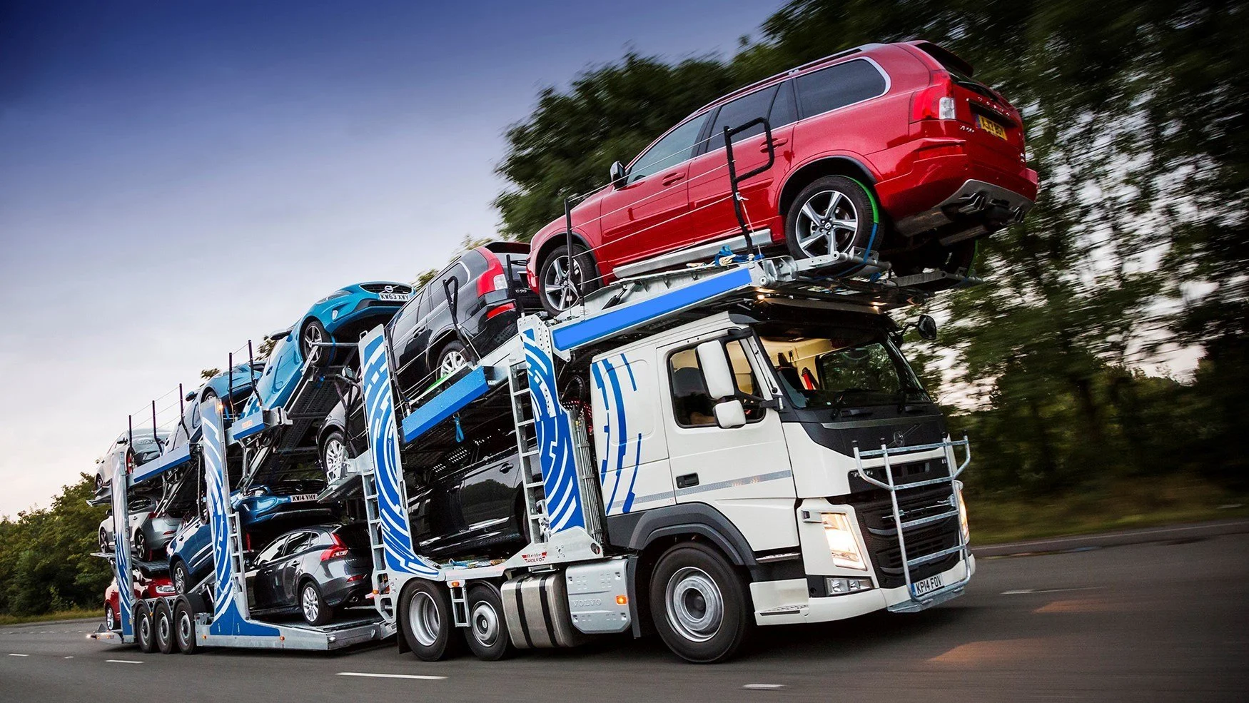Car transporter truck loaded with vehicles for intercity vehicle shipping