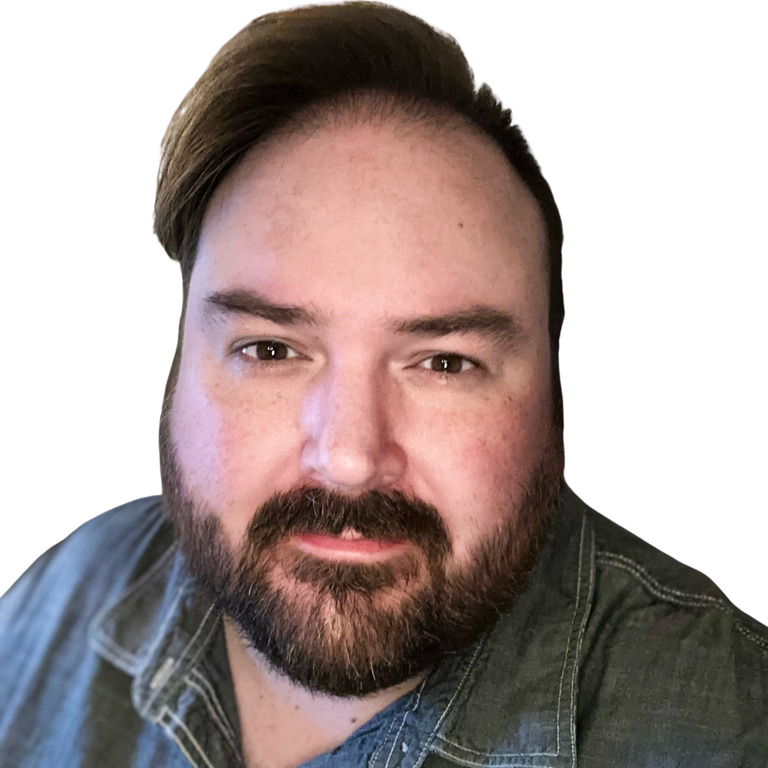 Jeremy Schmidt with beard and glasses wearing a blue-collared shirt and lanyard